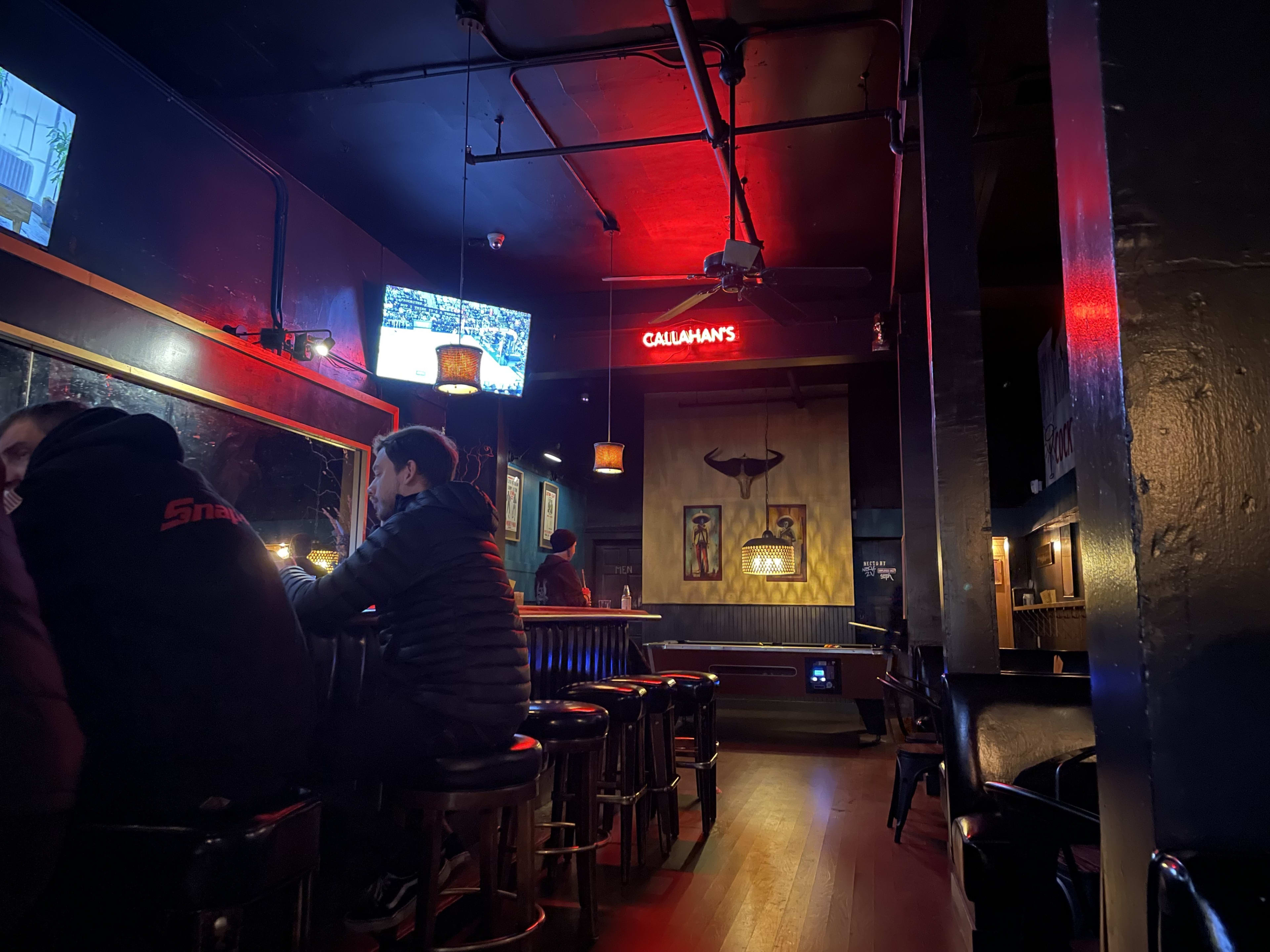 The interior of Mission Bar with a pool table and long bar