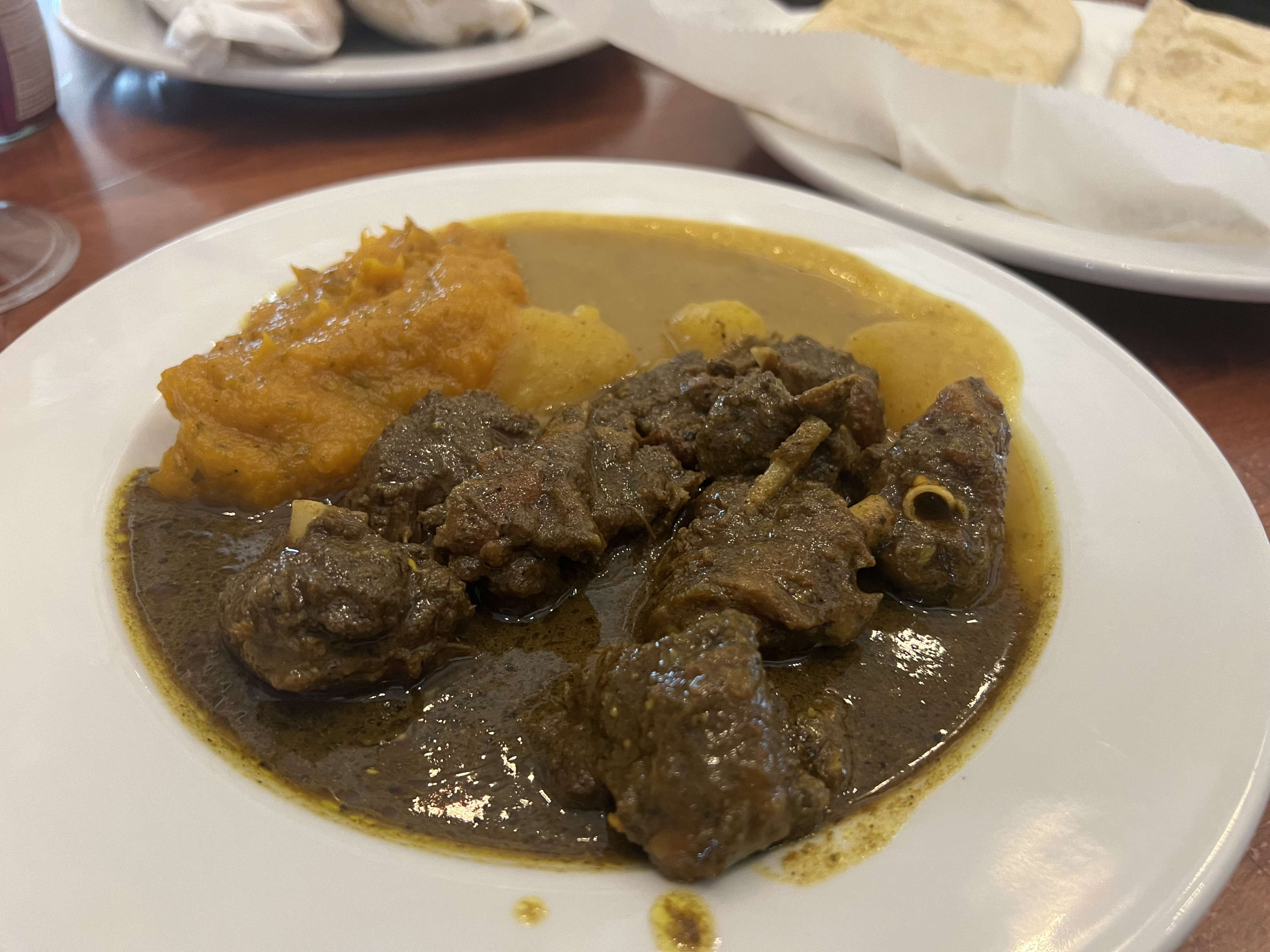 meat and curry sauce on a plate