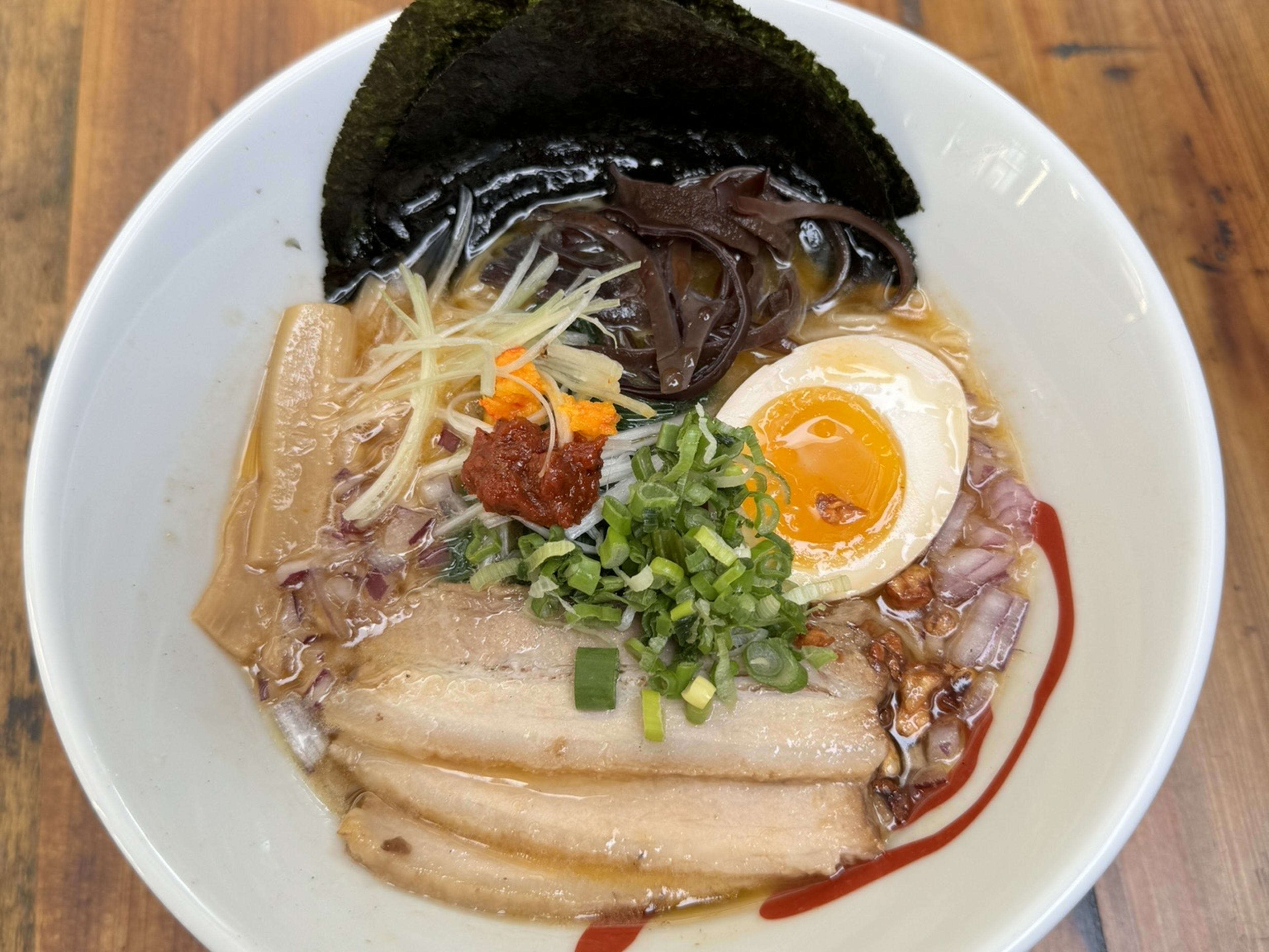 ramen with chashu, jammy egg, scallions, mushrooms, and nori