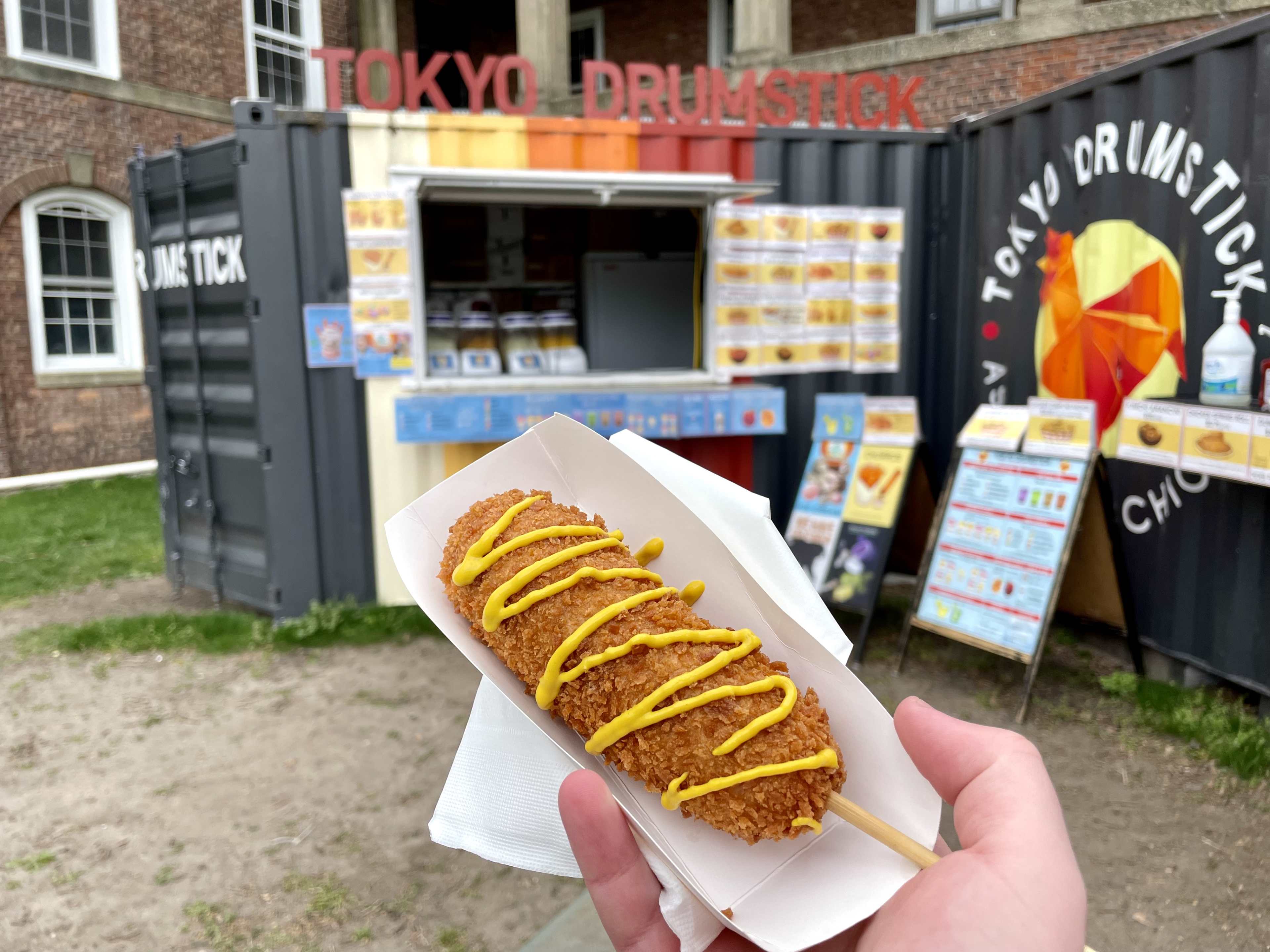 a korean corndog with a mustard drizzle