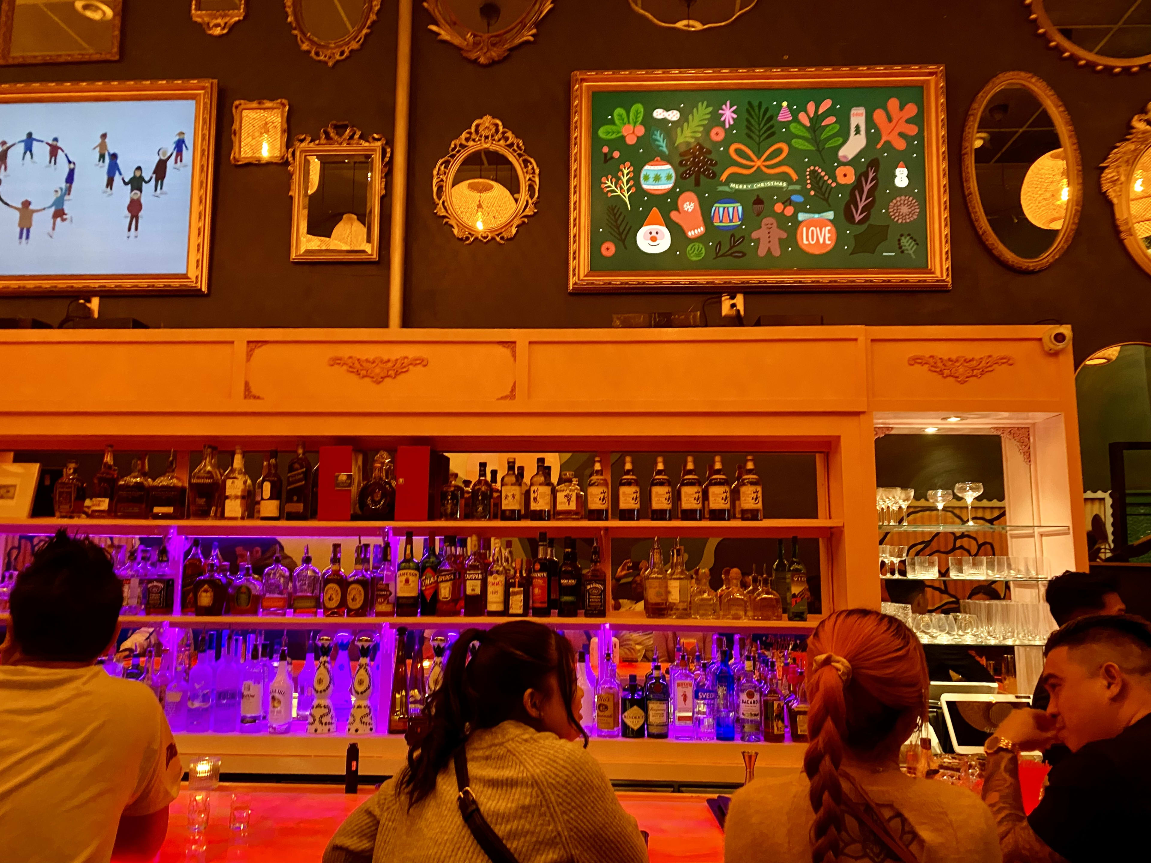 This is the neon-lit bar area at Miss Saigon Vietnamese Restaurant & Lounge in Midtown Village.