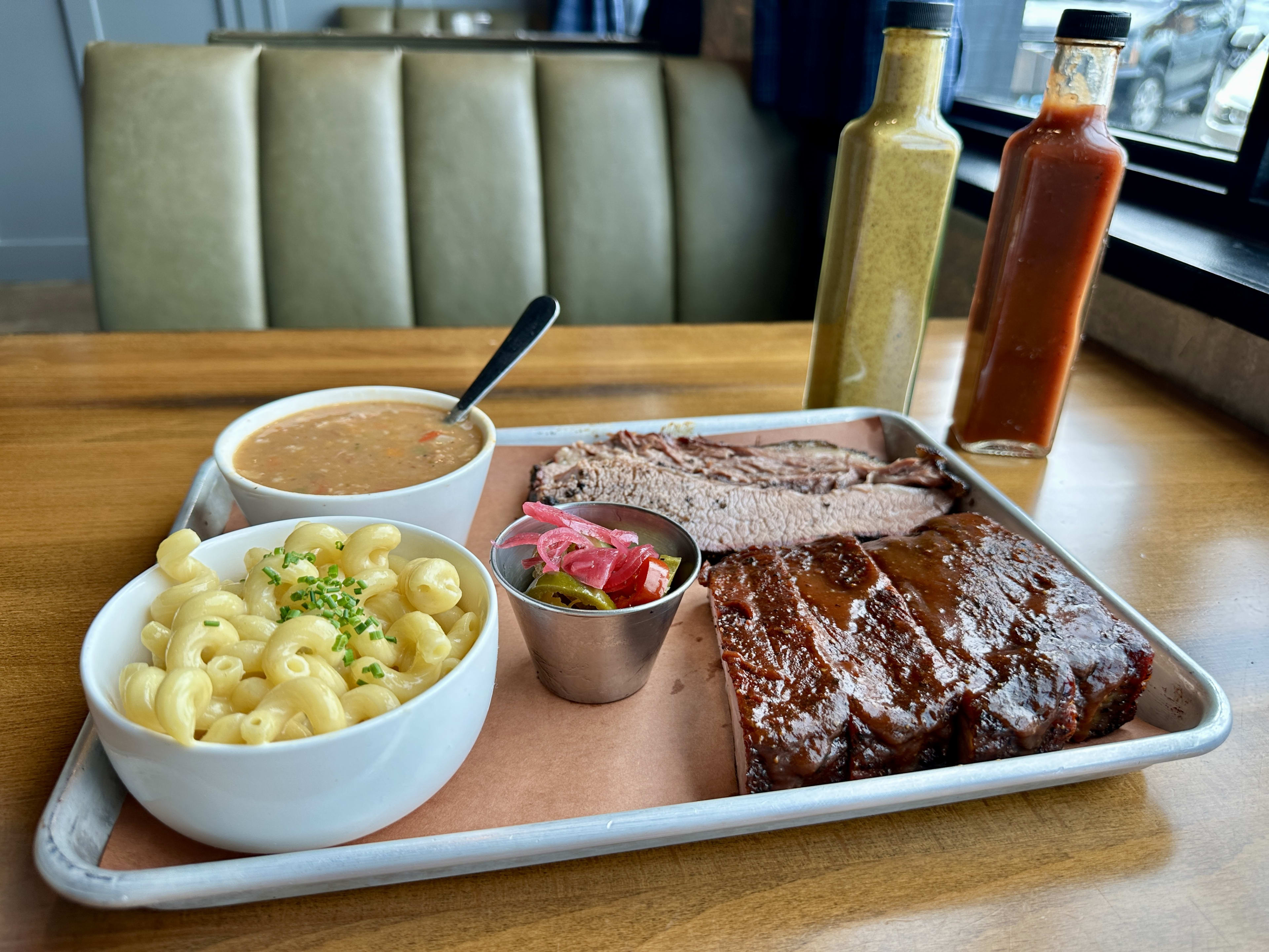 Smoked brisket platter with sides of beans and macaroni and cheese at Douglas Bar and Grill