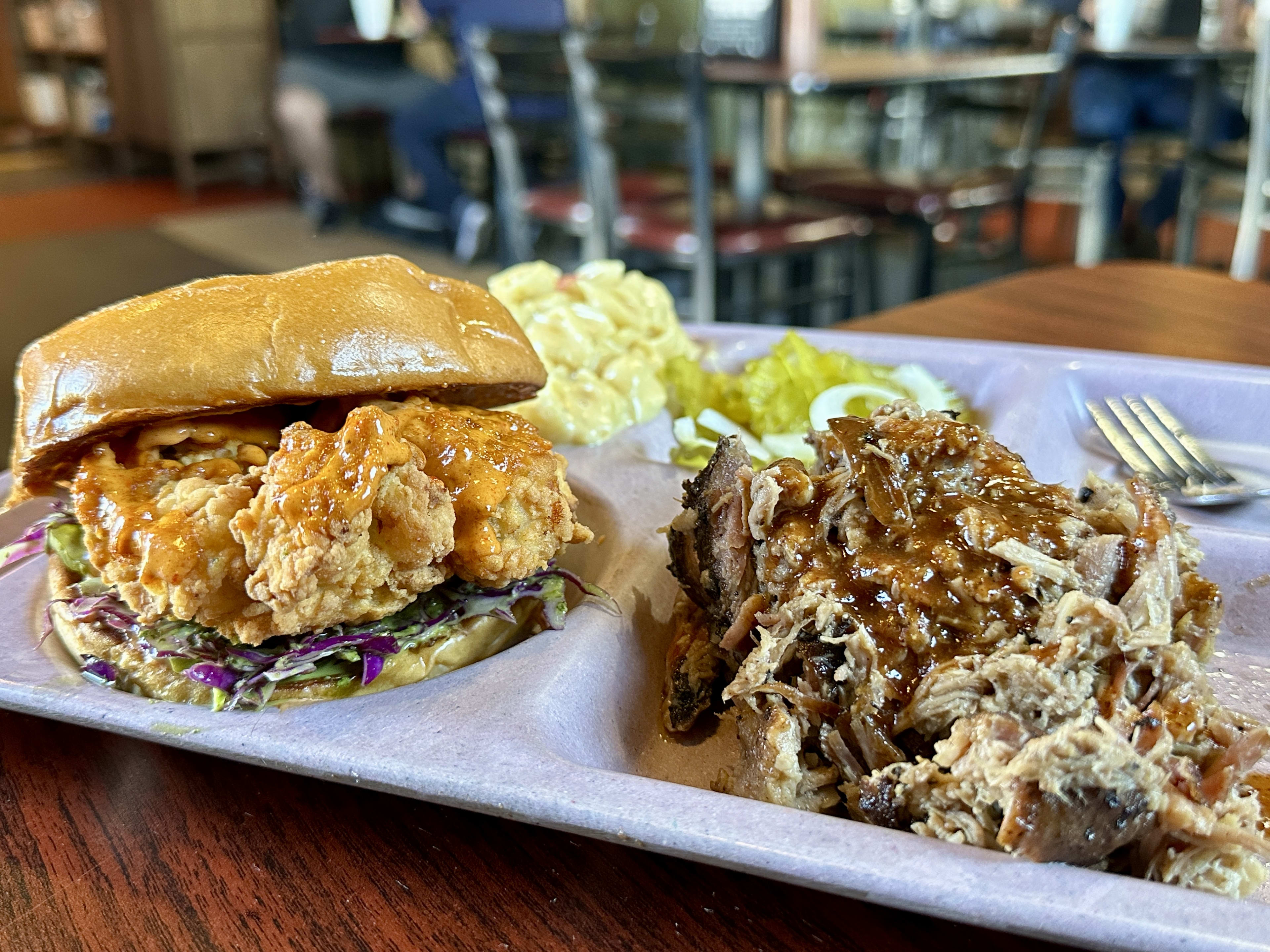 Fried chicken sandwich and pulled pork with side of coleslaw at Slow Bone BBQ