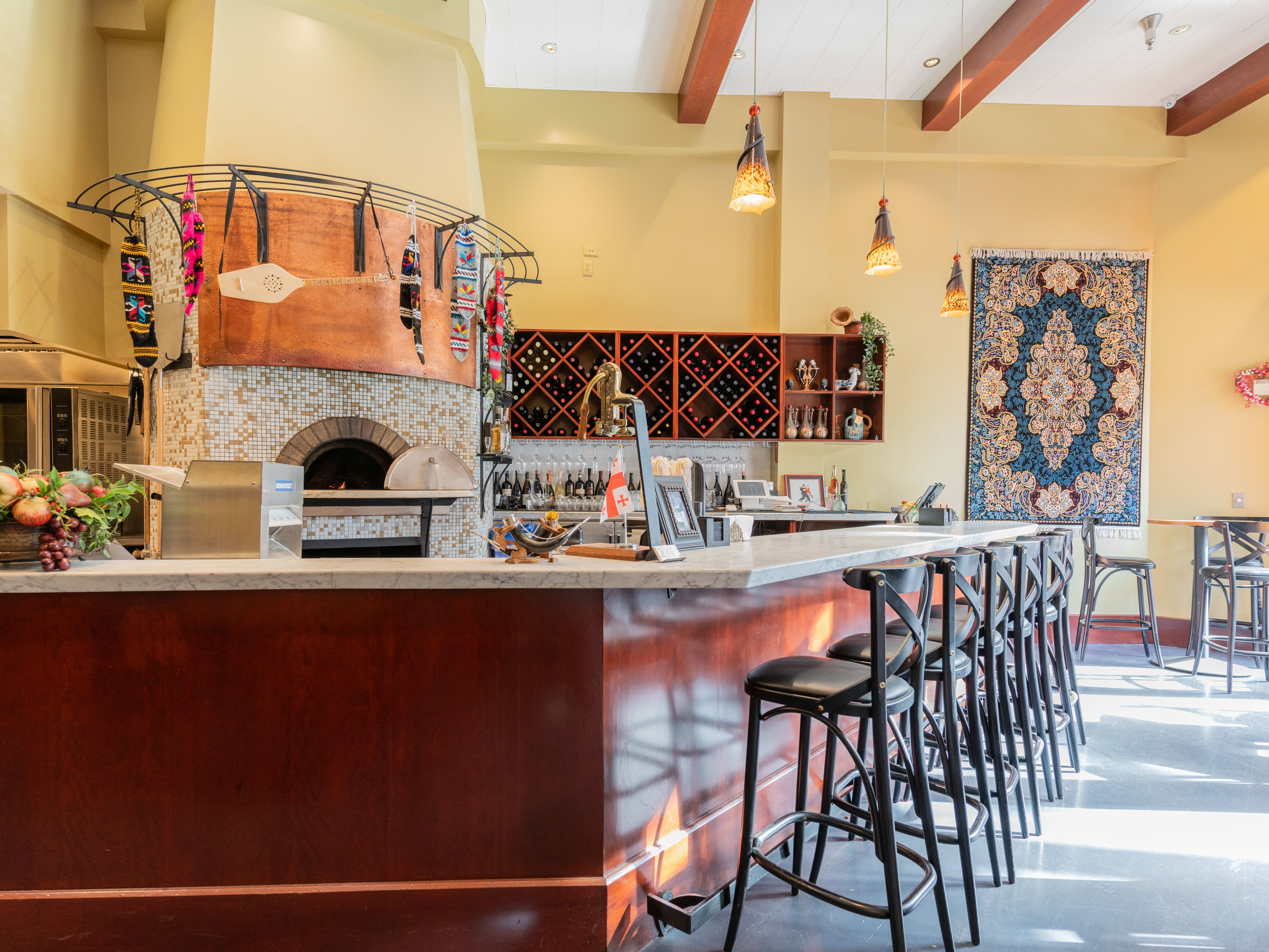 interior with pizza oven and bar seating