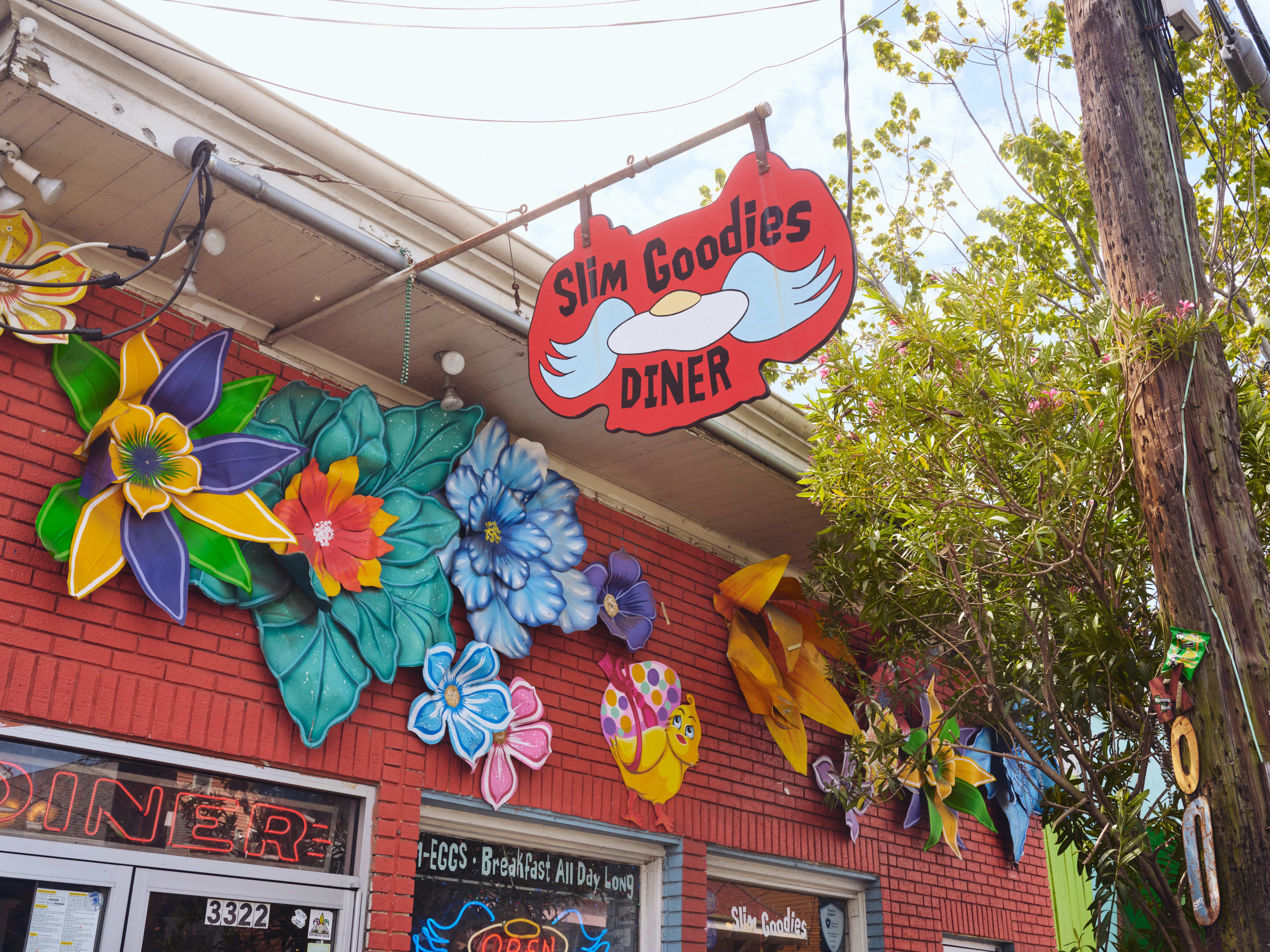 Bright red painted brick exterior at Slim Goodies Diner