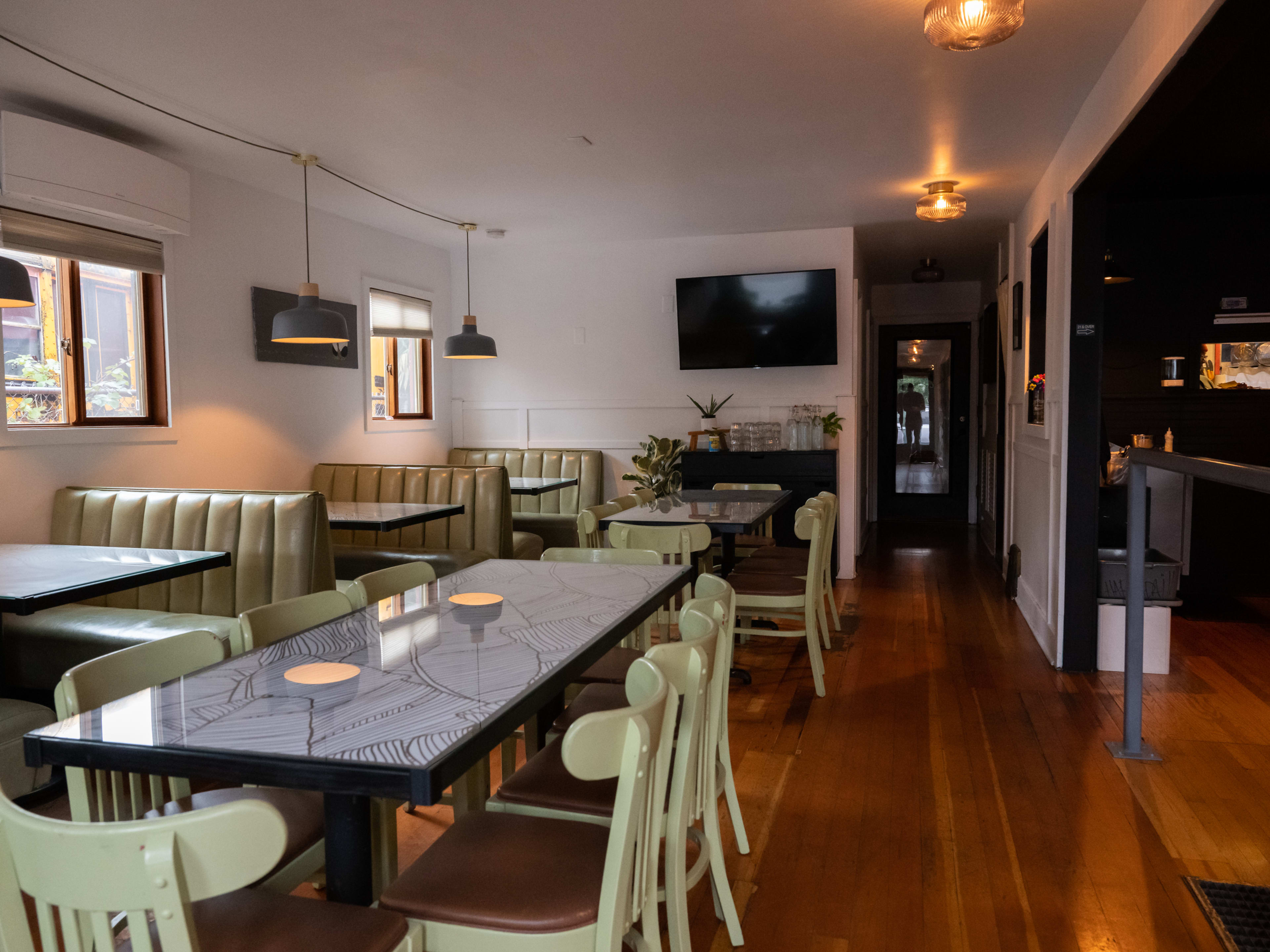 dining room with booths and a communal table