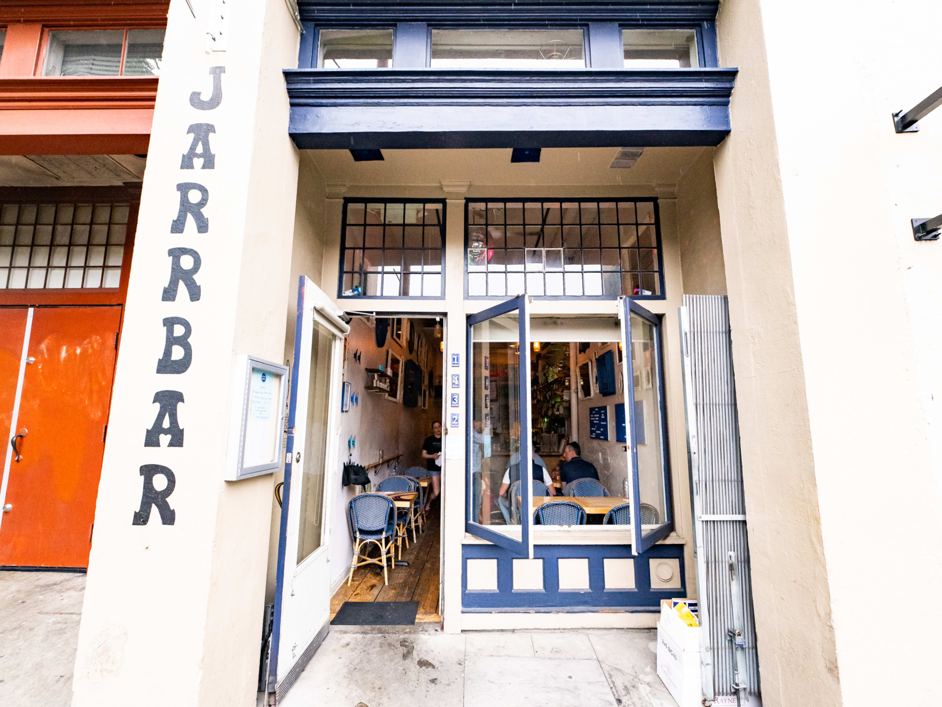 Exterior of Jarrbar, a white building with dark blue trim