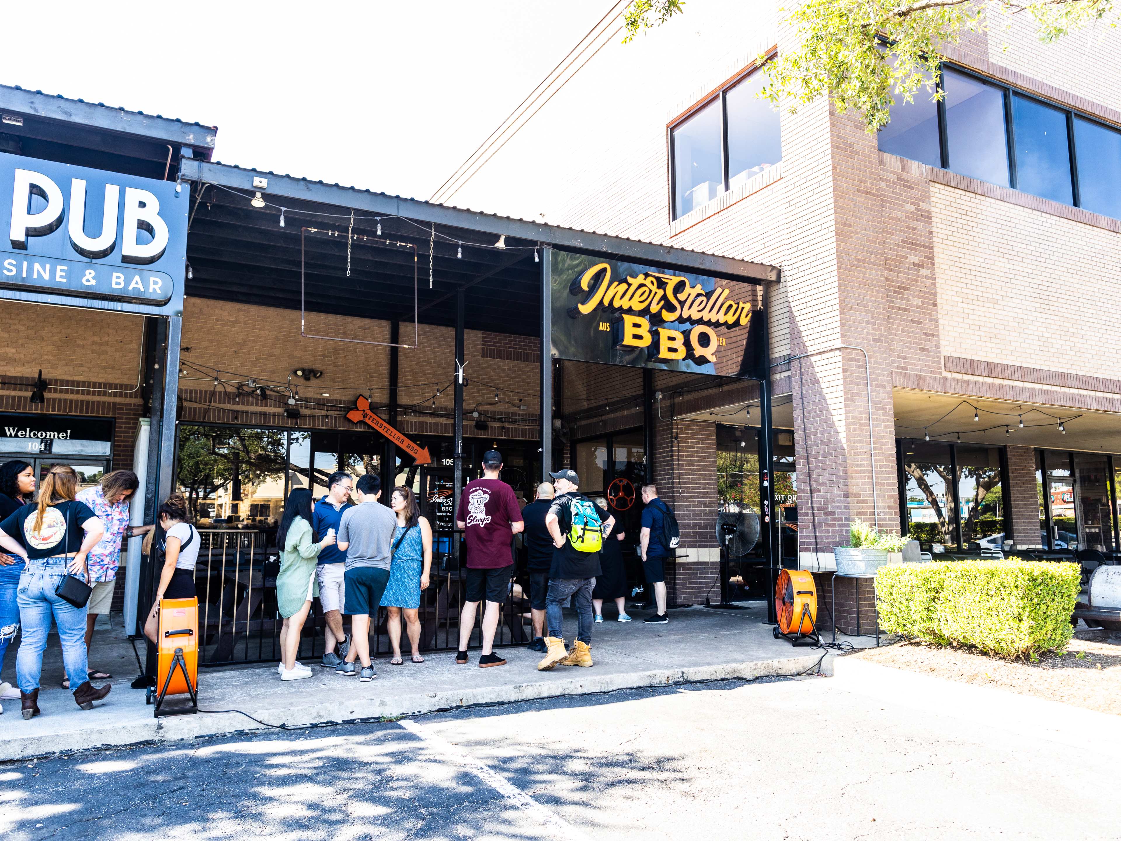 People lining up outside to order at Interstellar BBQ.