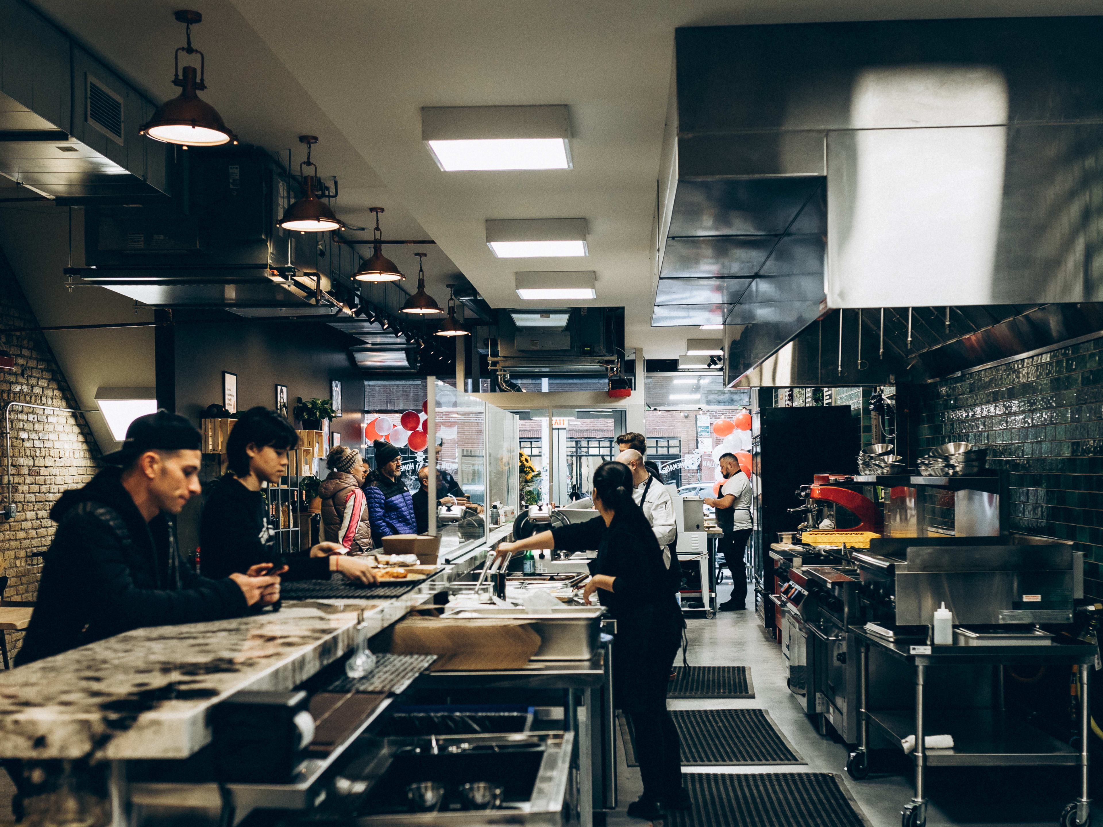 Open kitchen and bar seating at Italian Homemade Company