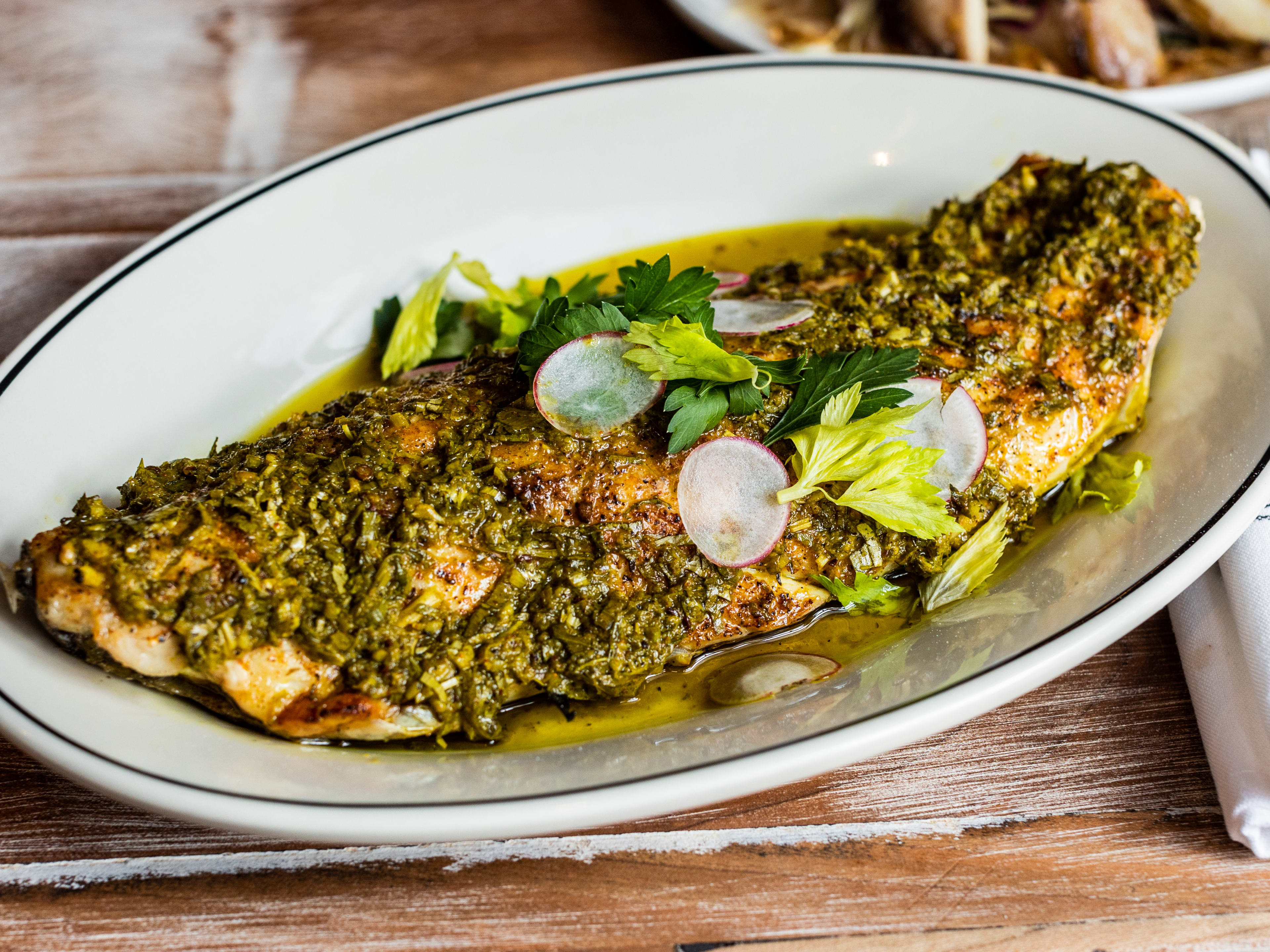 The half shell redfish coated in chermoula from Josephine’s.