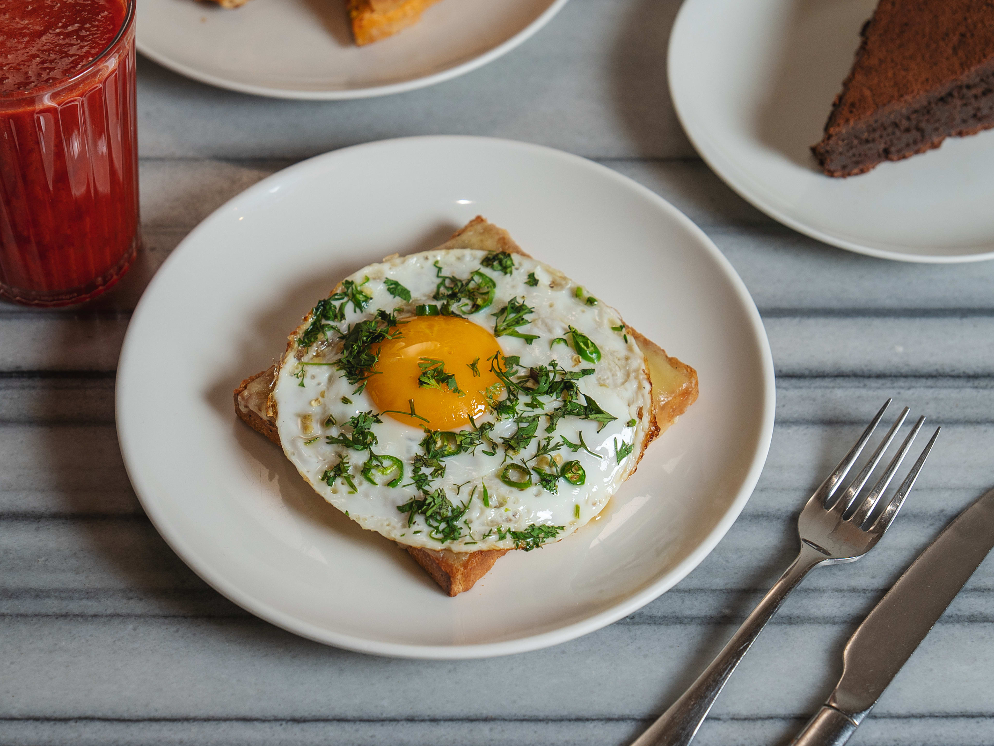 Eggs kejriwal on white ceramic plate at Kala Ghoda Cafe