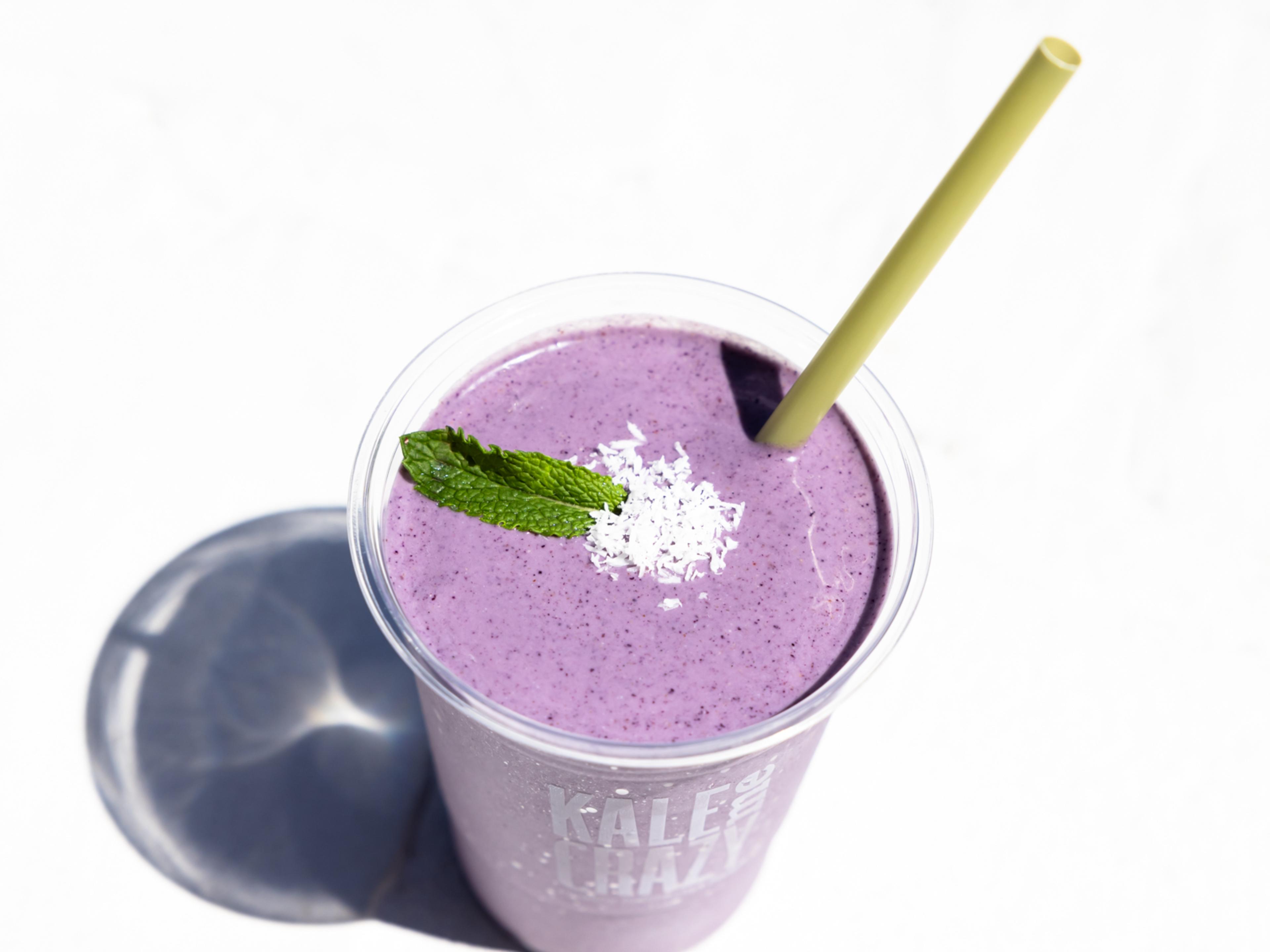 purple smoothie with mint and coconut flakes