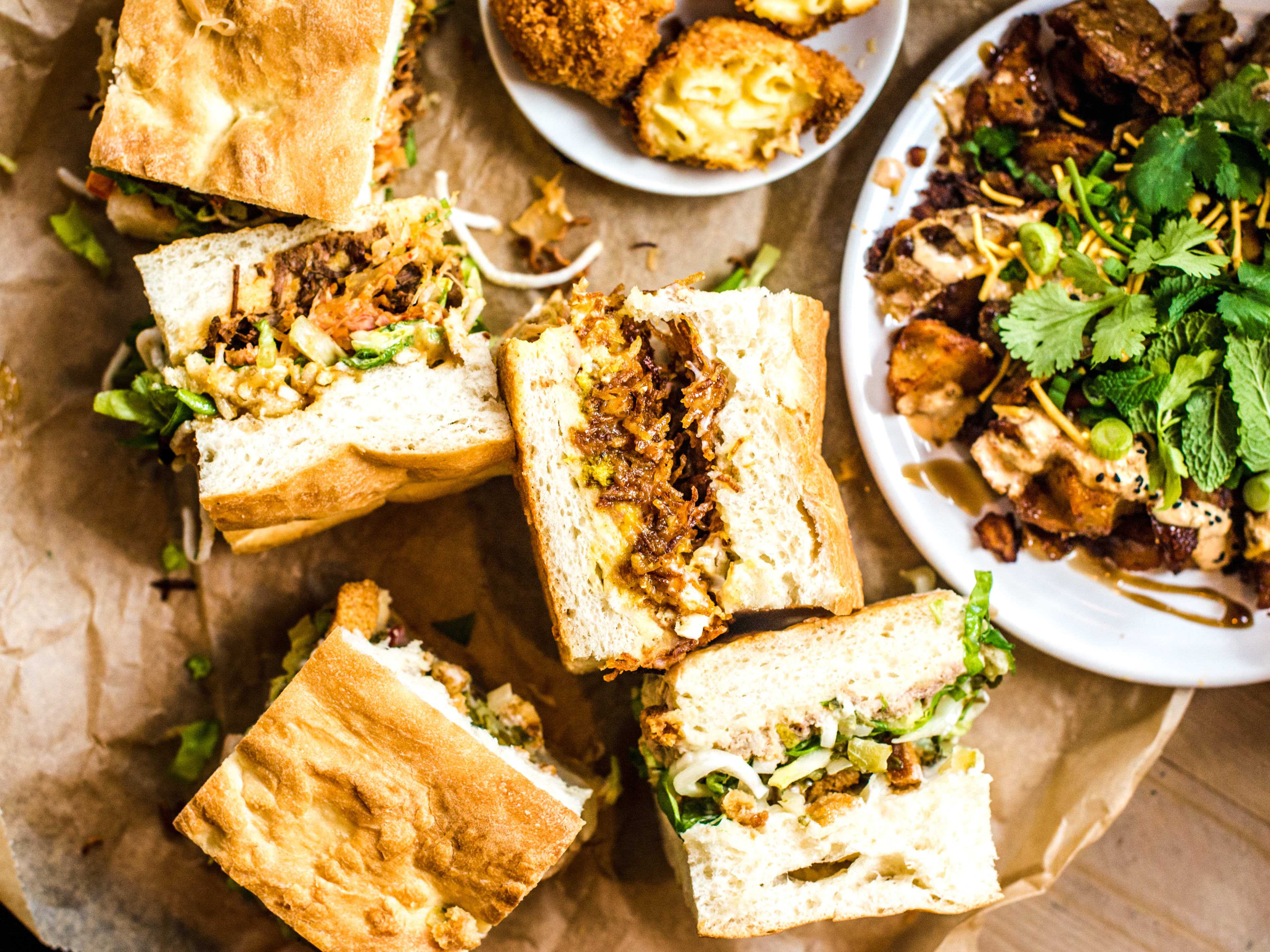 A spread of sandwiches, mac and cheese balls, and spuds from Max’s Sandwich Shop.