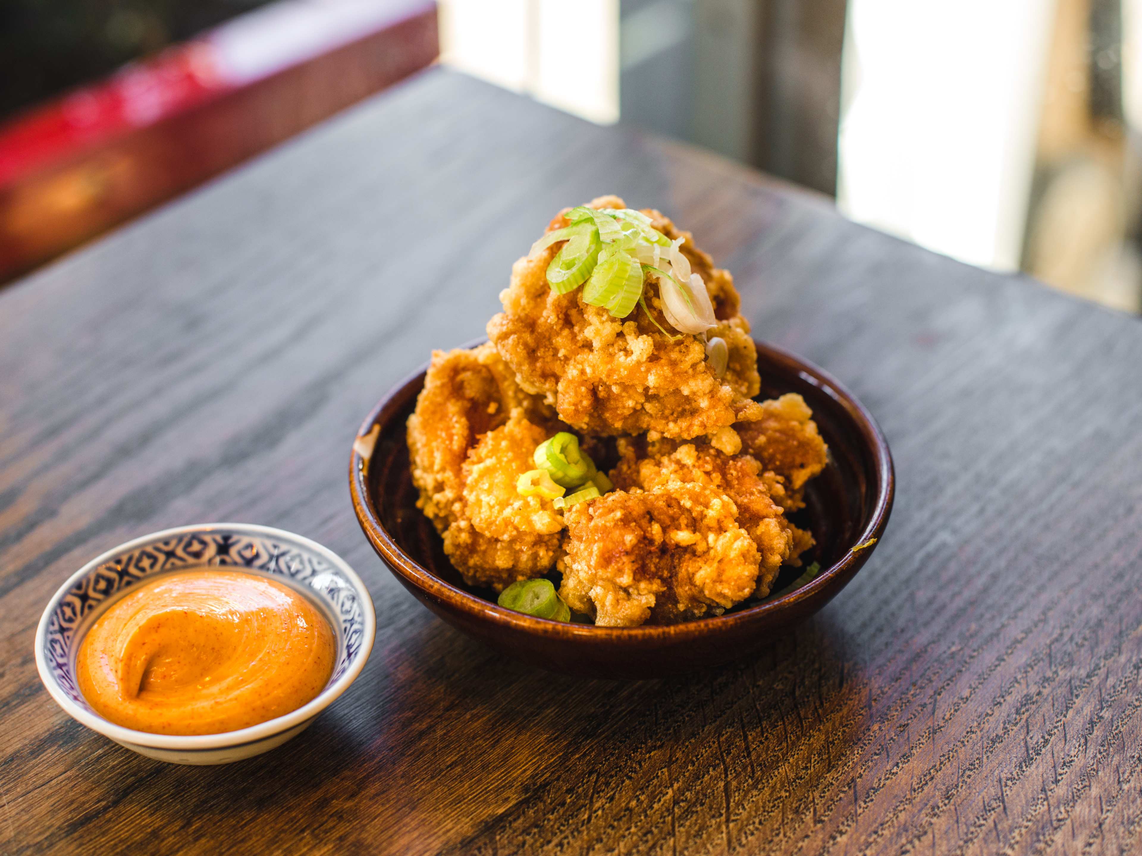 The fried chicken from Mr Bao with a side of sauce.