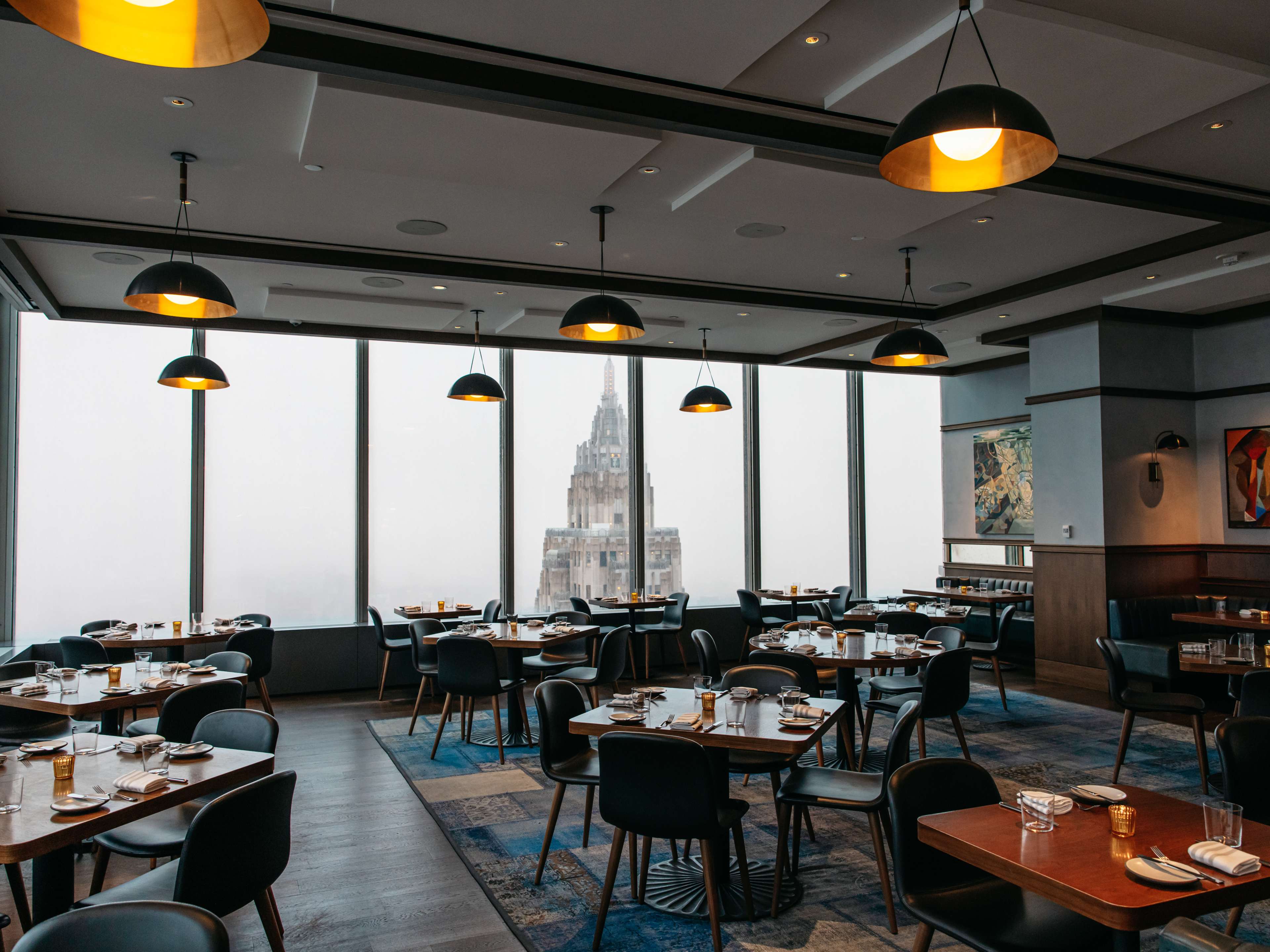 The dining room at Manhatta with a view of the Empire State Building.