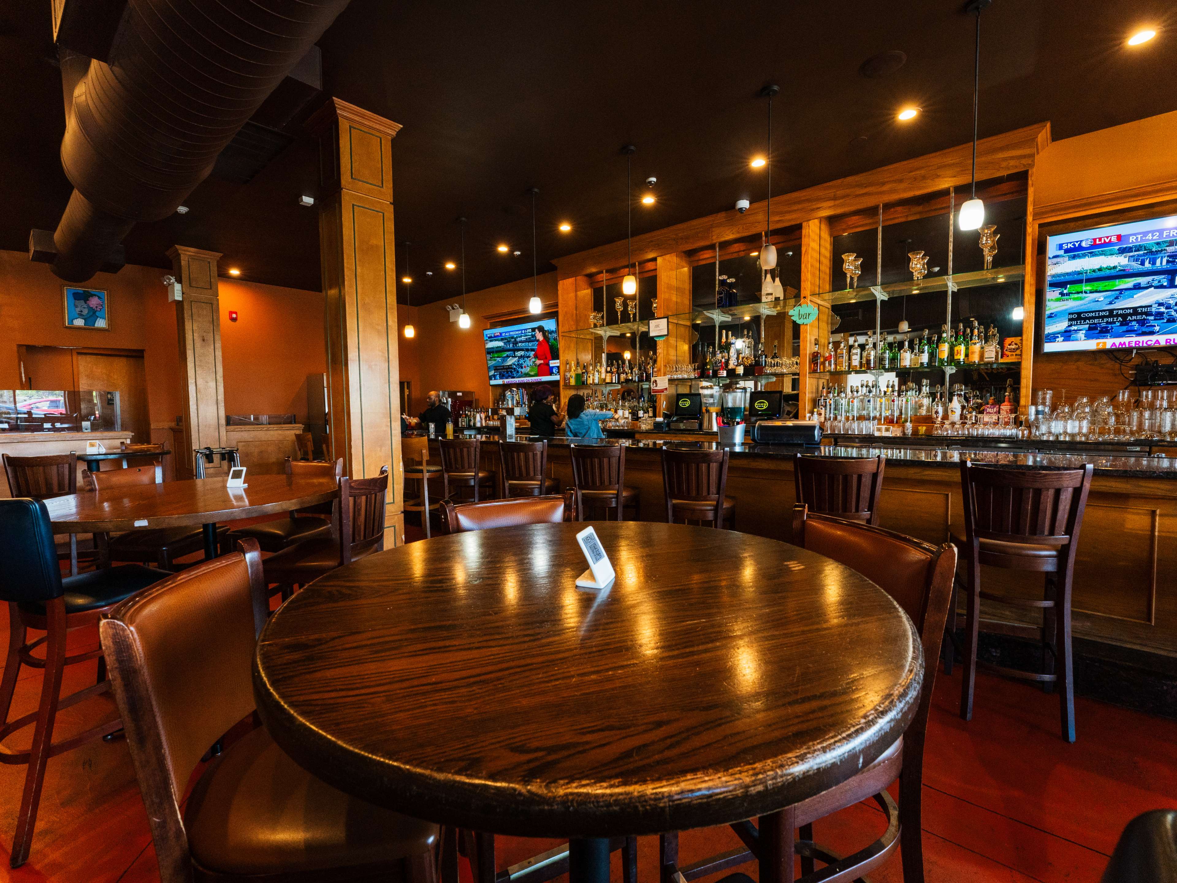 The interior dining room of a bar.