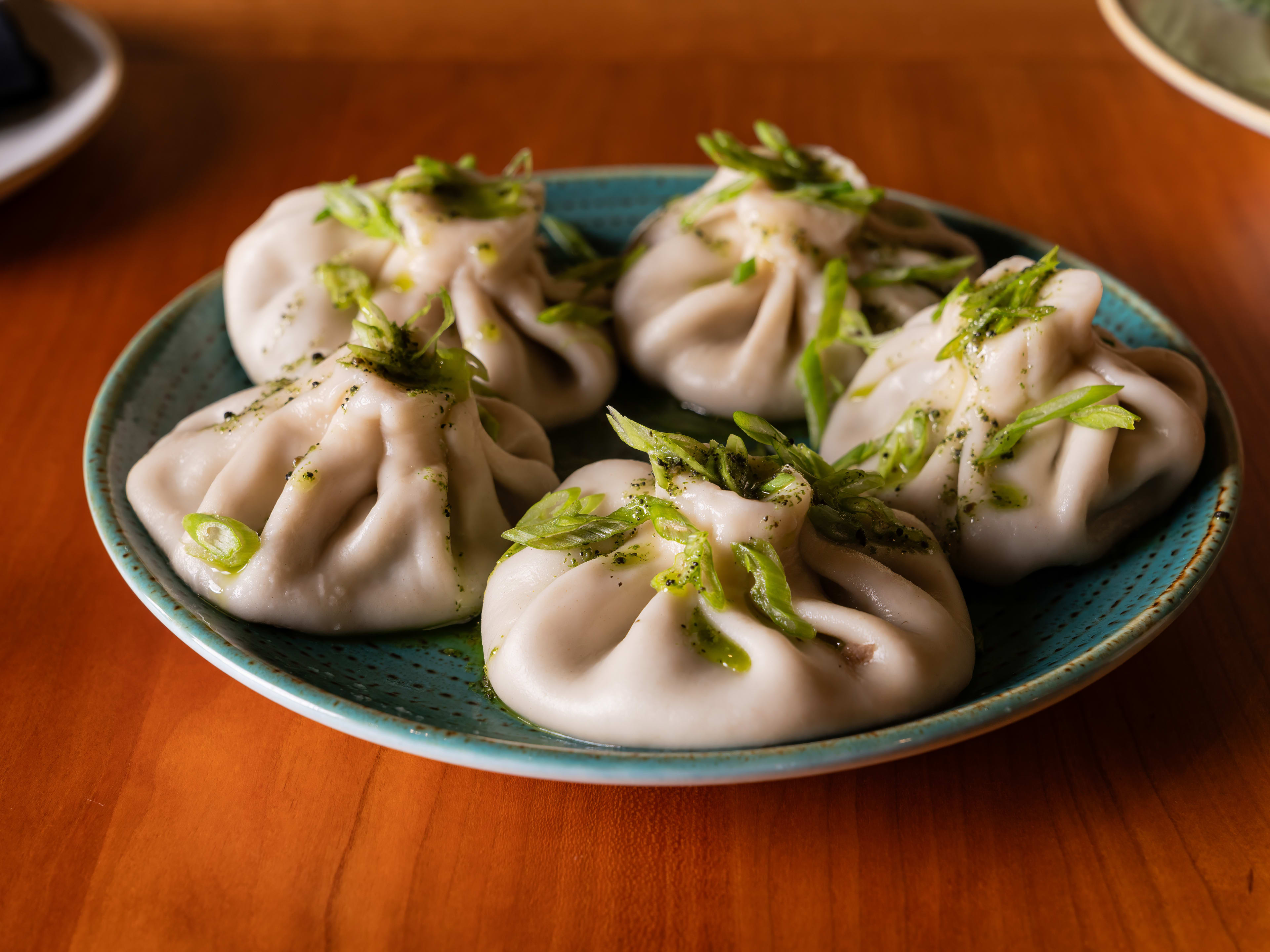 Five khinkali on a plate at Bevri