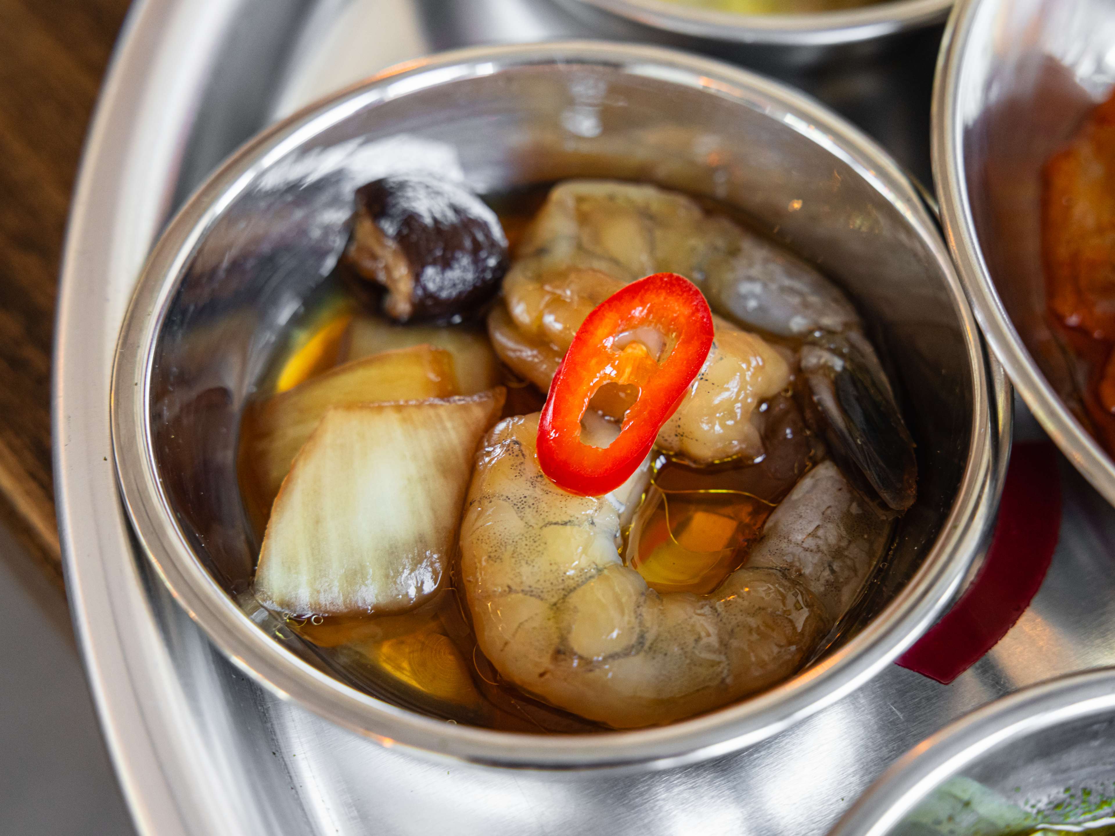 A small bowl of soy-marinated shrimp.