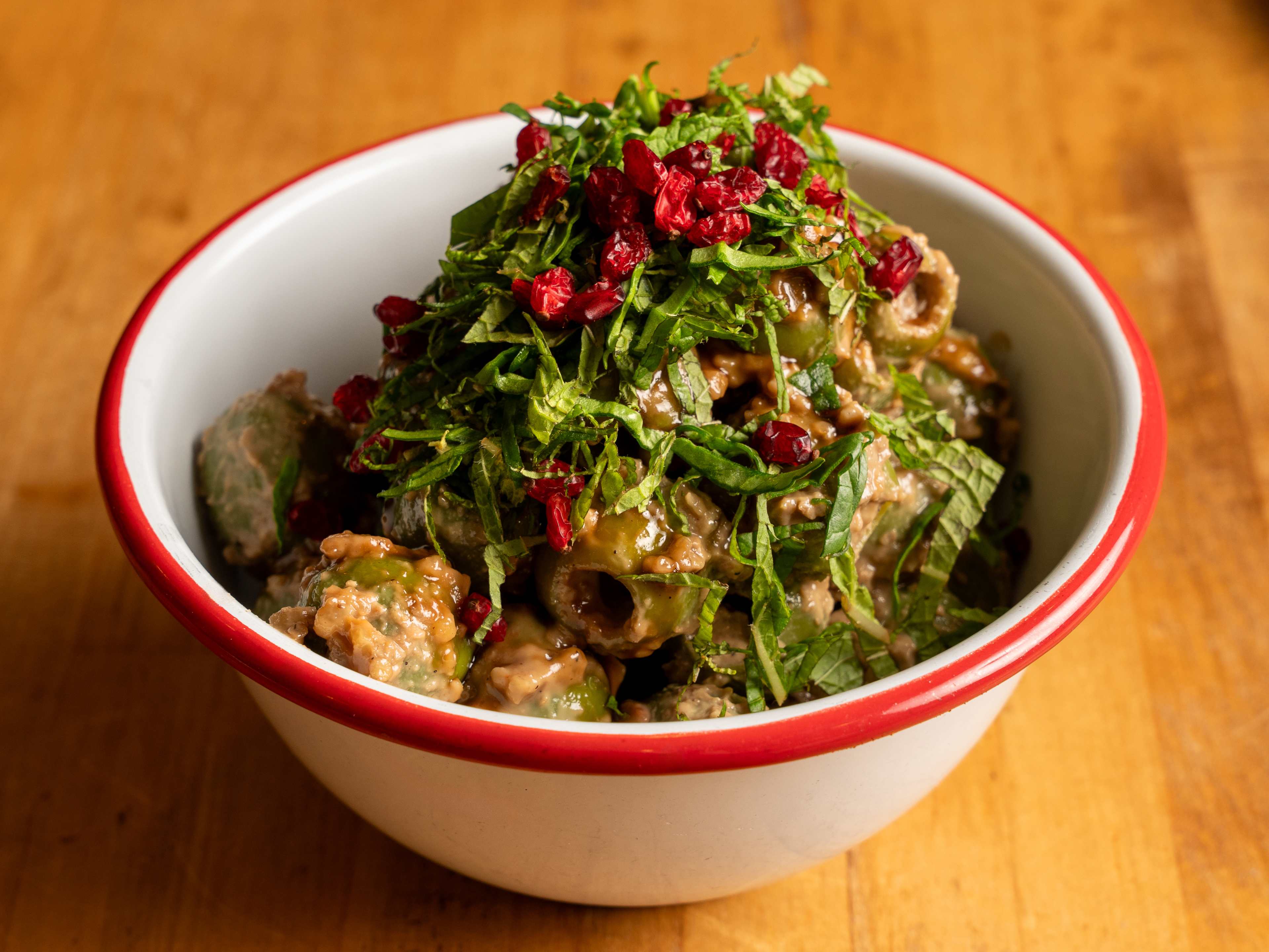 A bowl of marinated olives at Komaaj Mazze Wine Bar