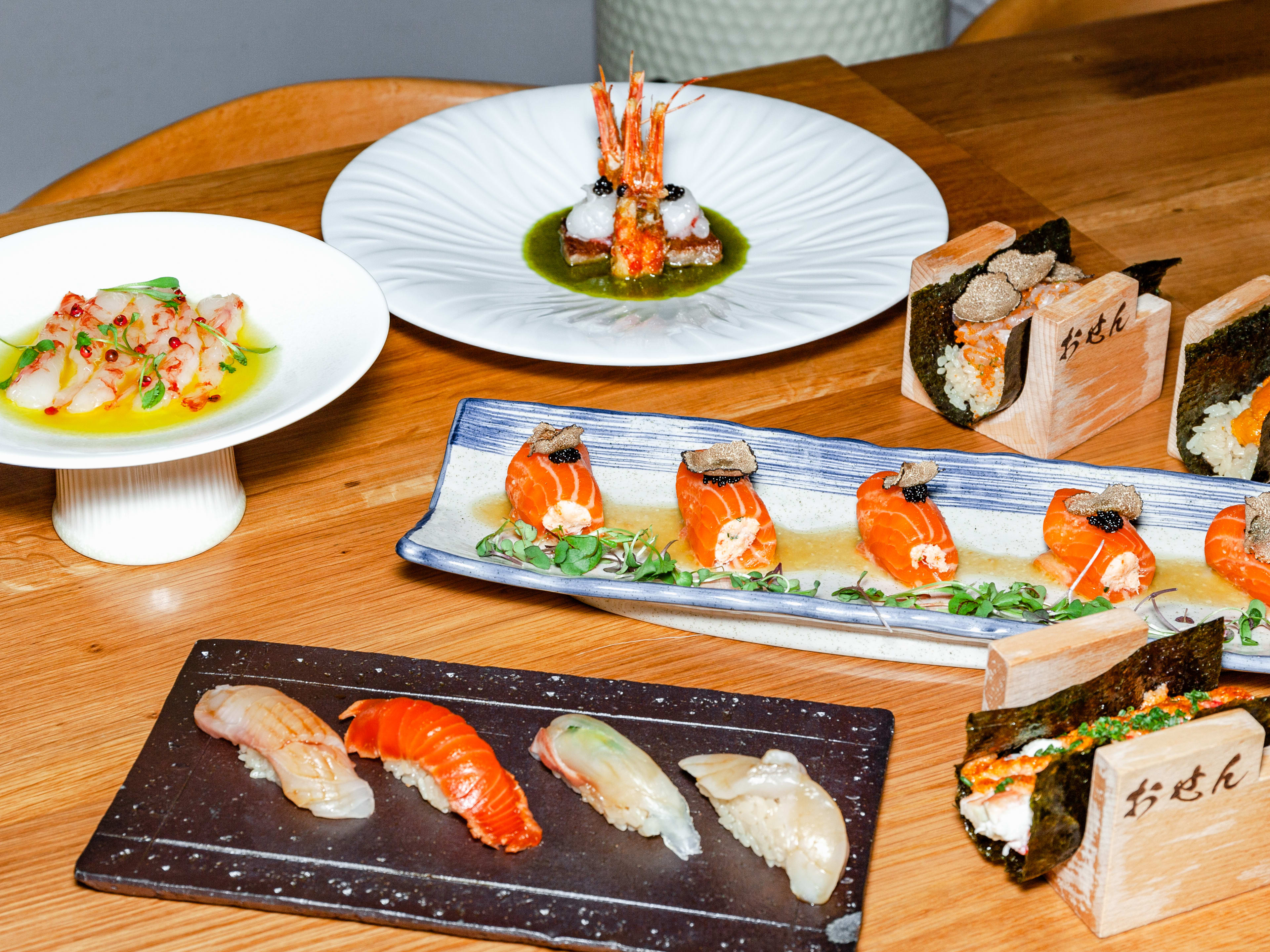 A spread of dishes from Omakase By Osen.