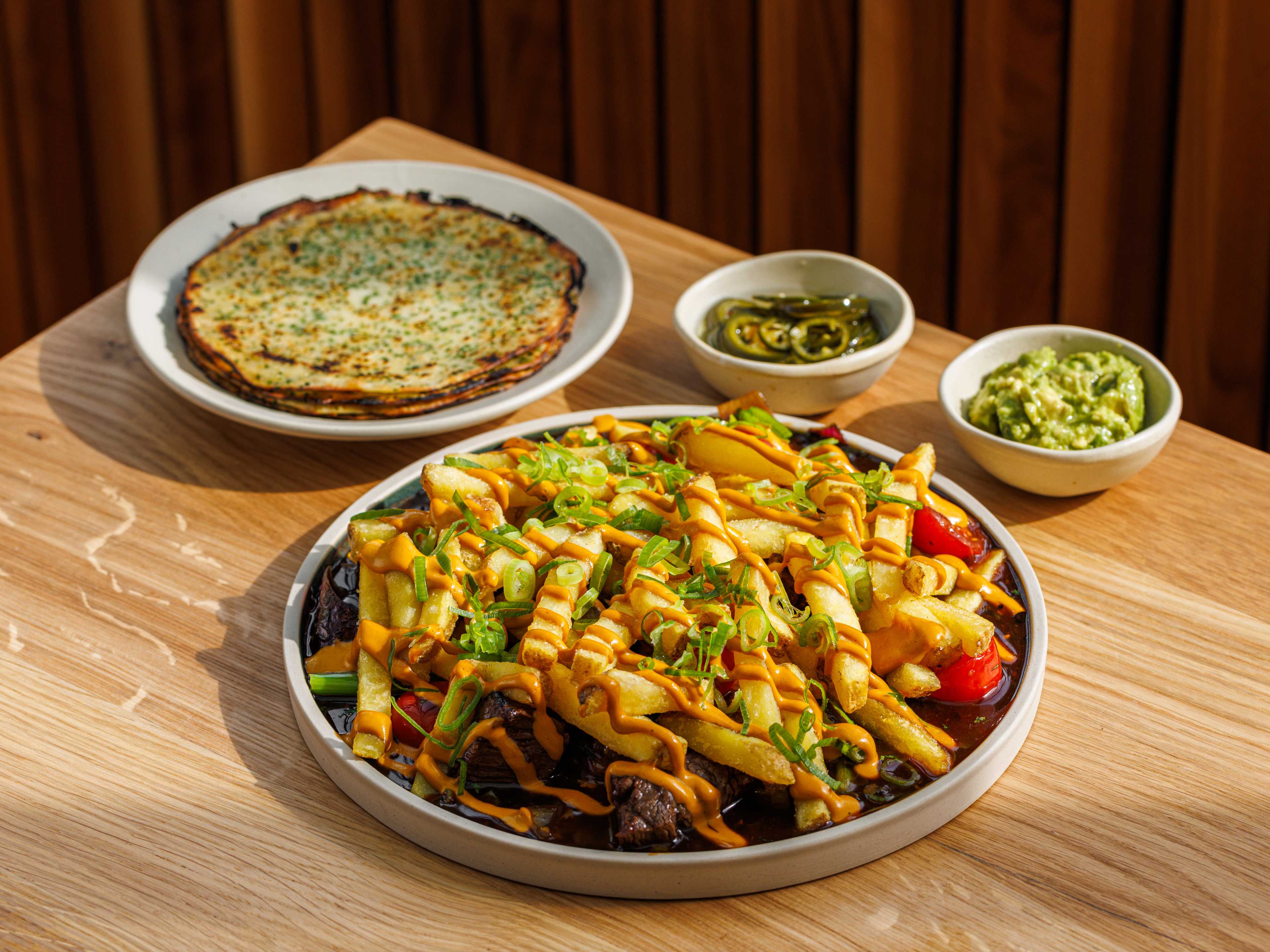 The 'lomo saltado' with scallion pancakes, chips, and guacamole from Llama Inn in Shoreditch.