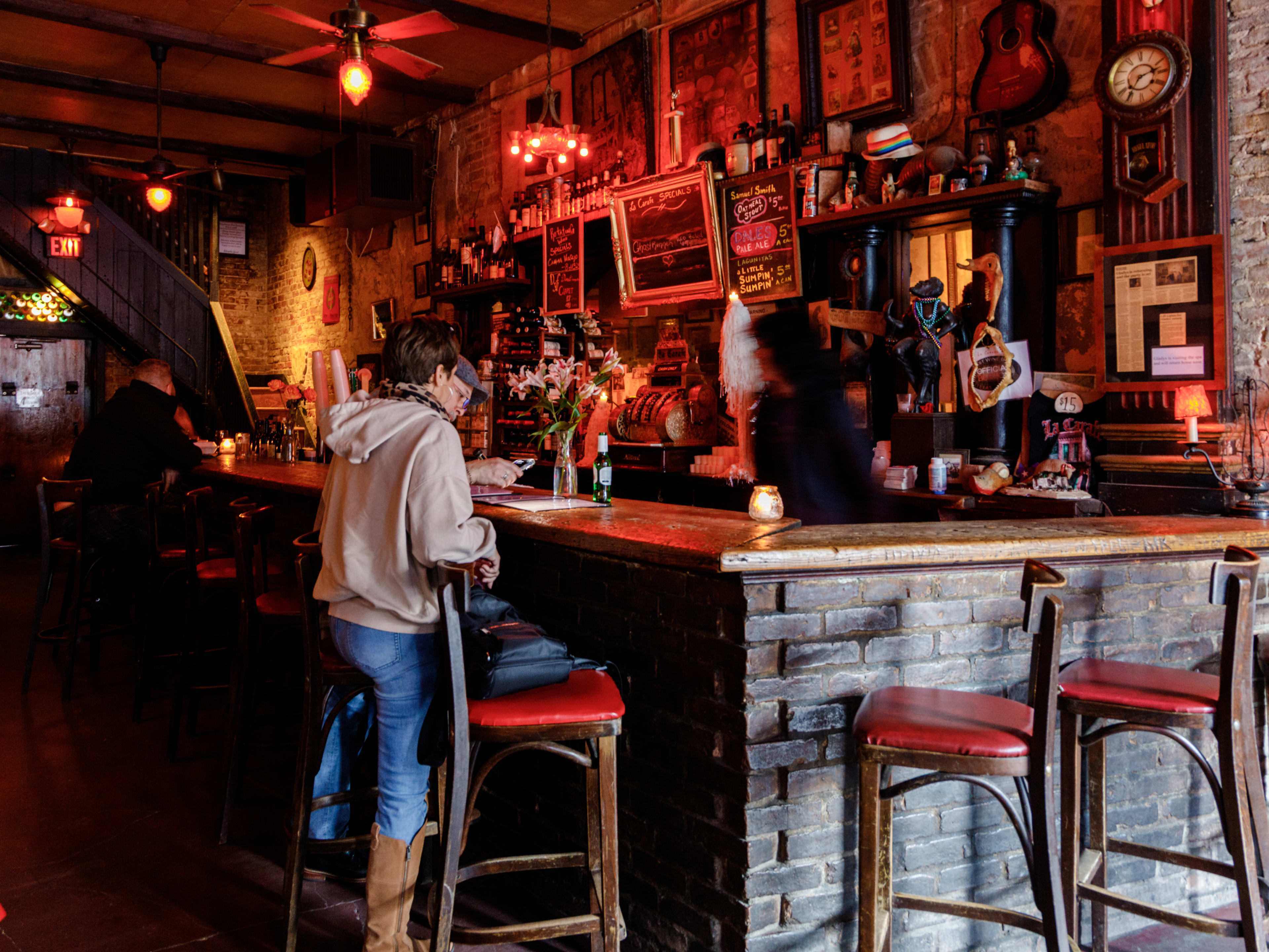 People order at the bar at La Carafe.