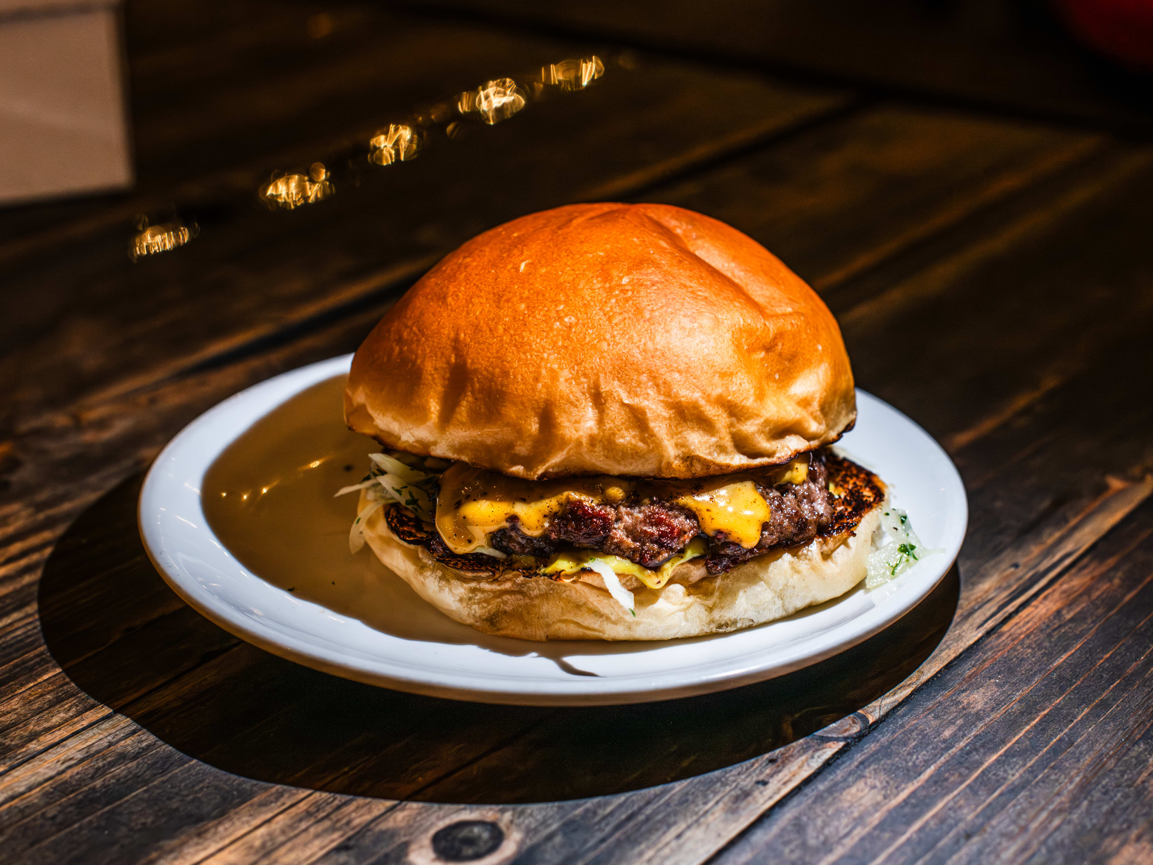 A smashburger on a plate at Lagom.