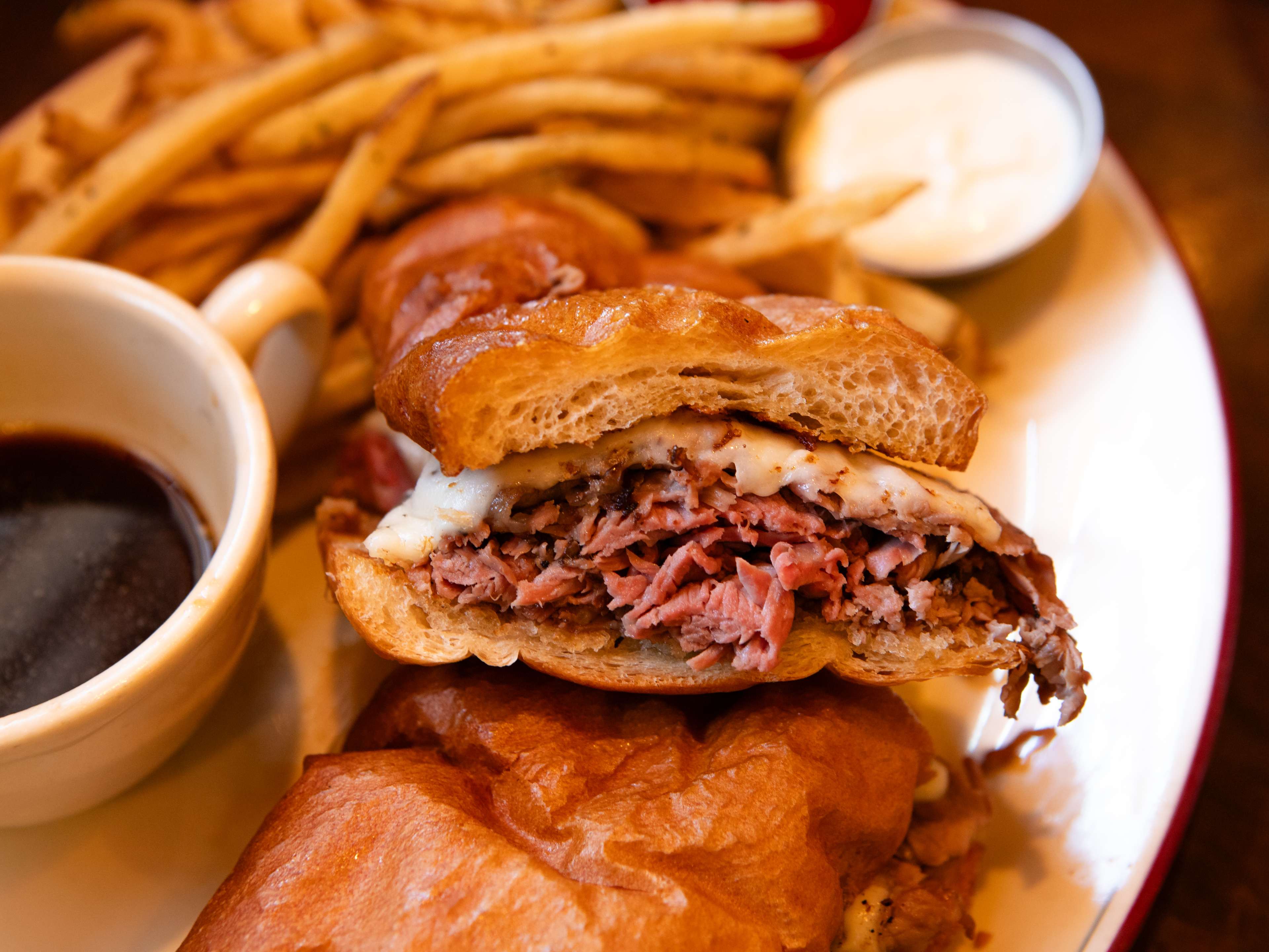 A french dip sandwich with a side of fries from Laurenzo’s.