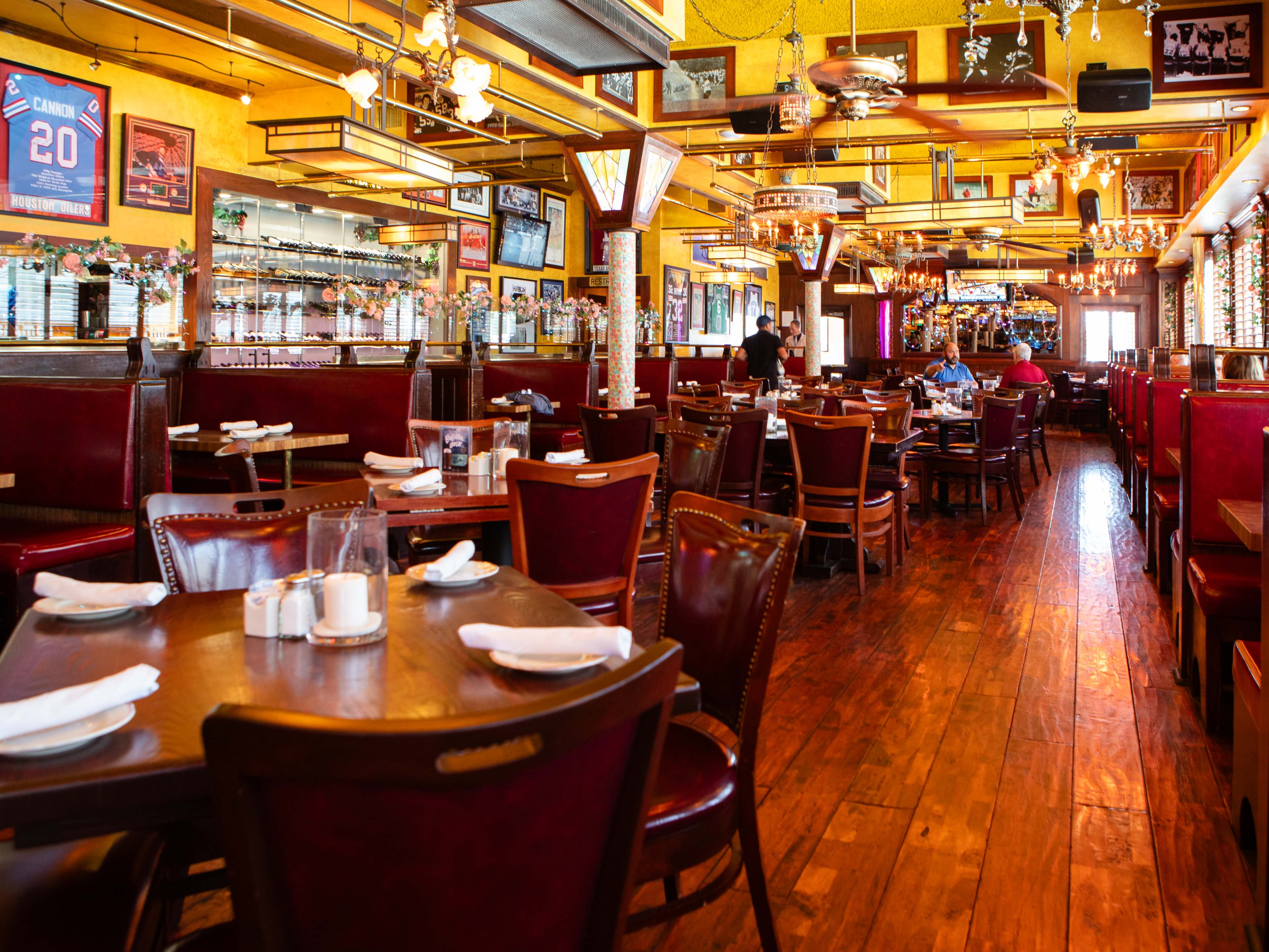 interior of Laurenzo's with wood tables and yellow ceilings