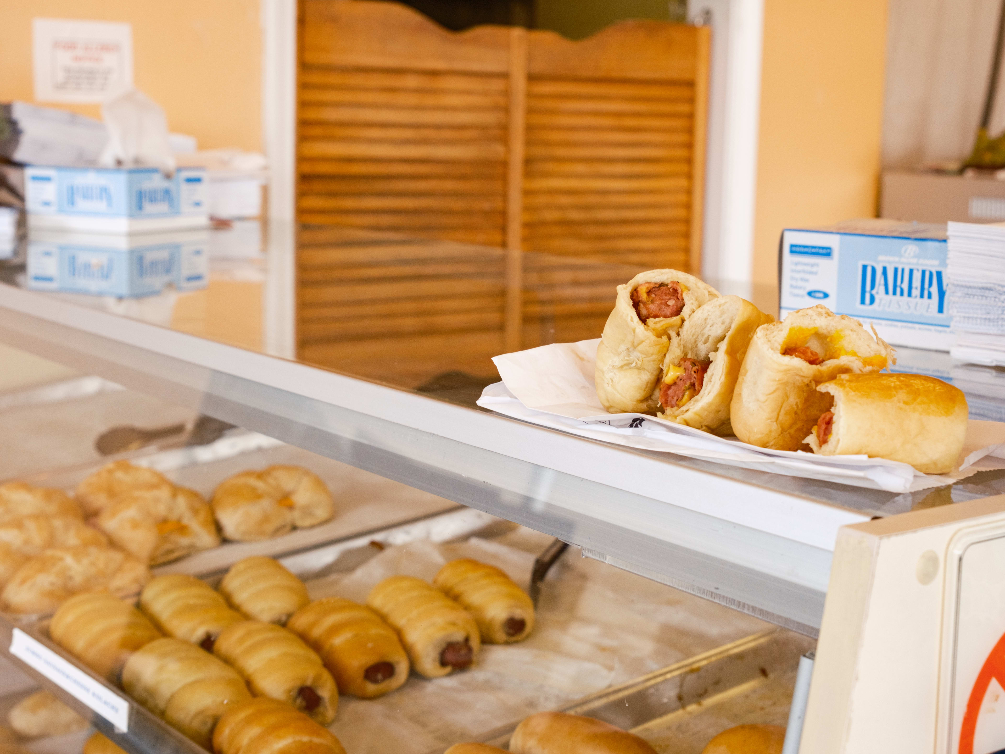 Kolaches from Le Donut on top of their pastry case.