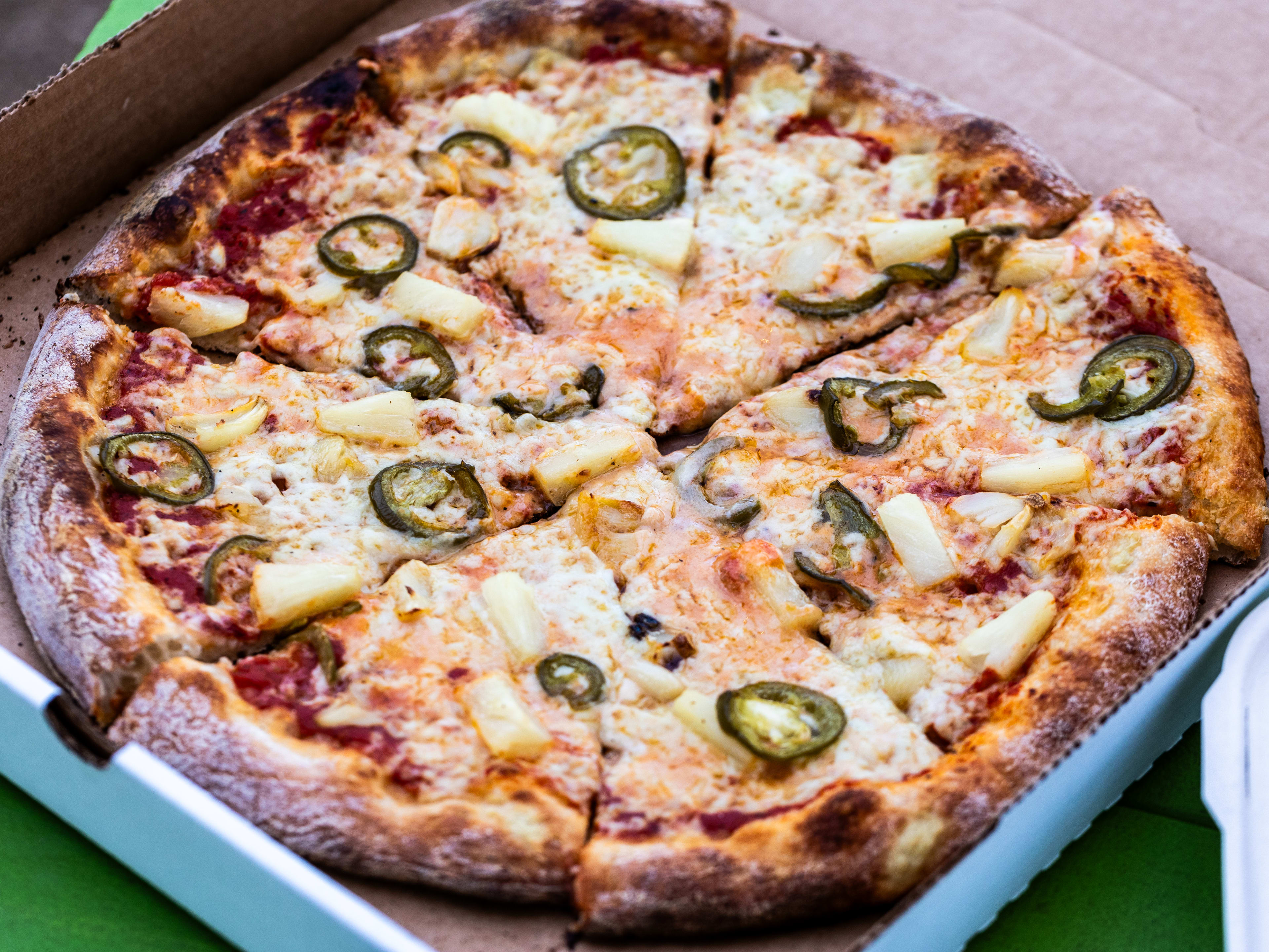 The NY Style Pina Jalapeno pie in a pizza box.