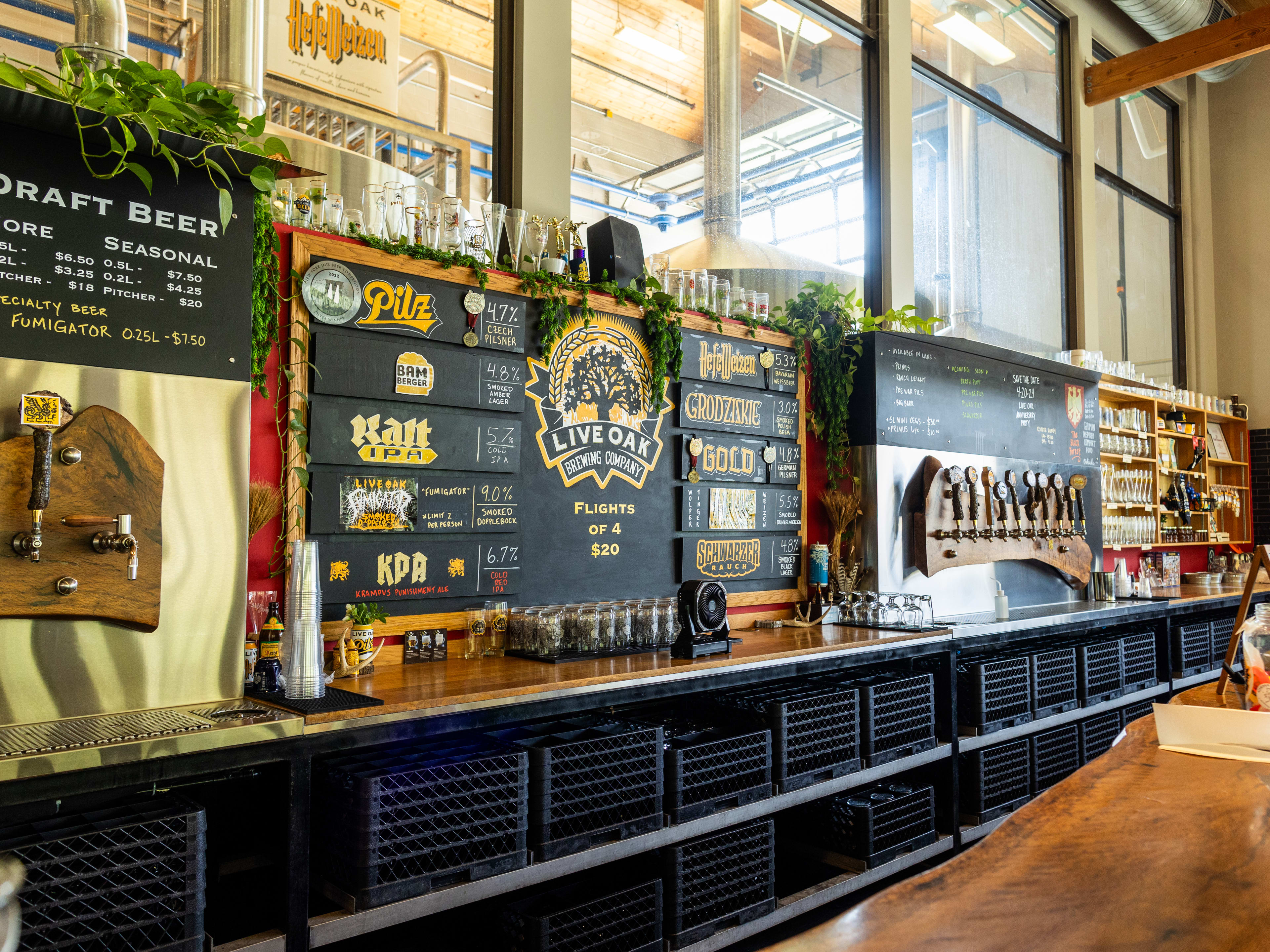 The bar at Live Oak with the menu, and taps lining the wall.