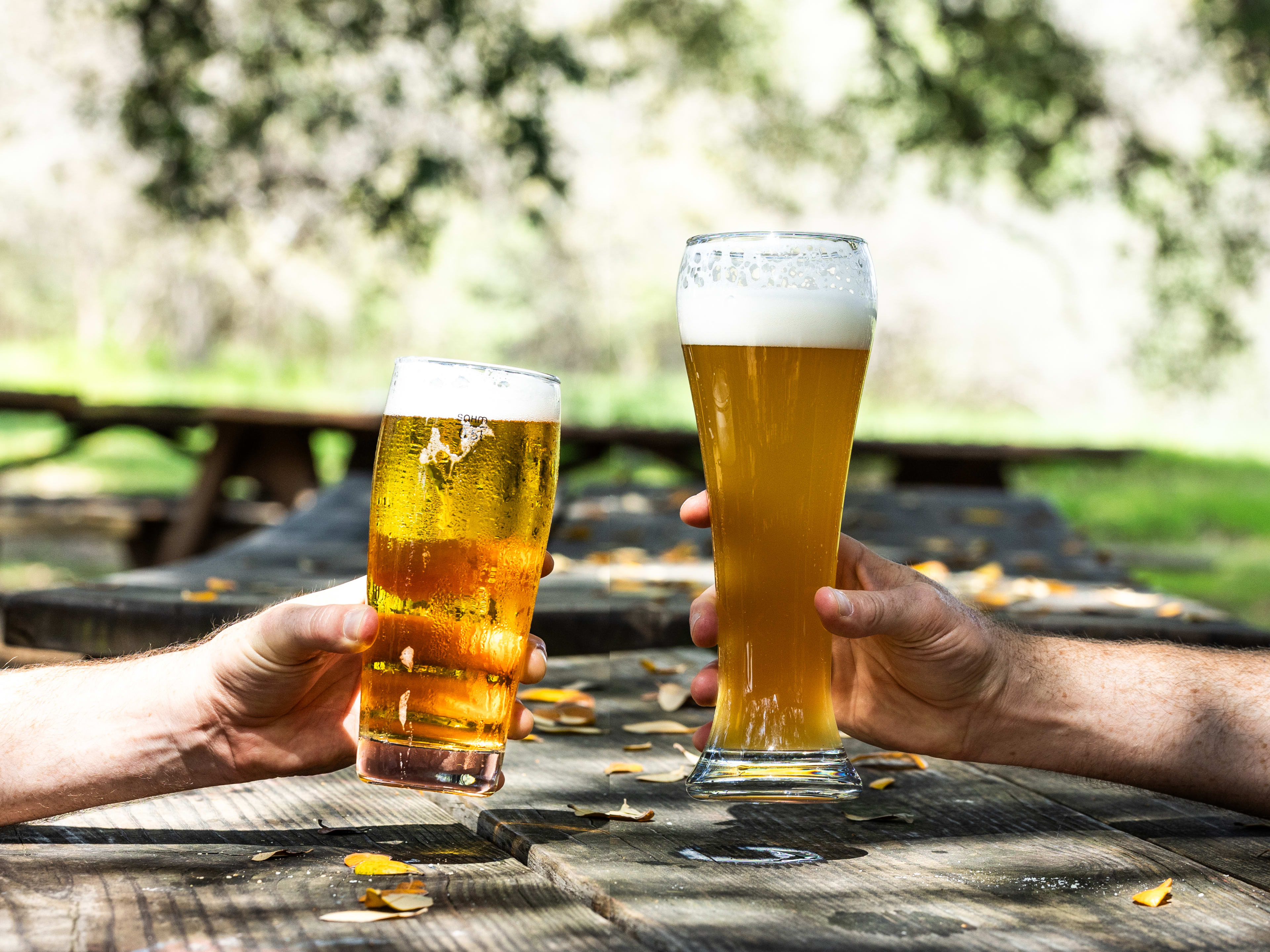 Two people cheers outside at Live Oak.