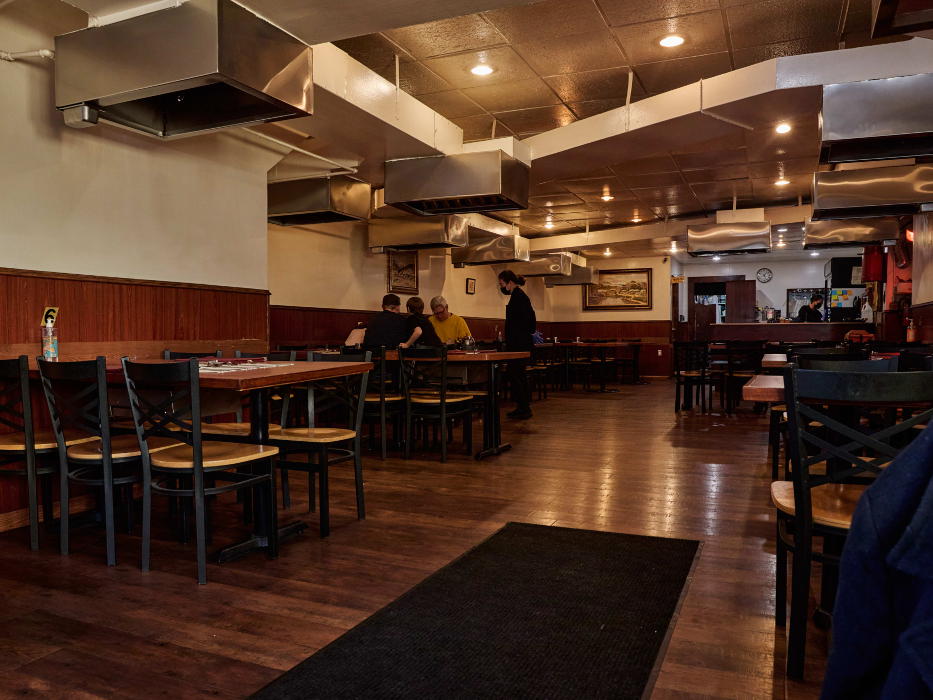 The interior with tables and grills at Brothers Restaurant