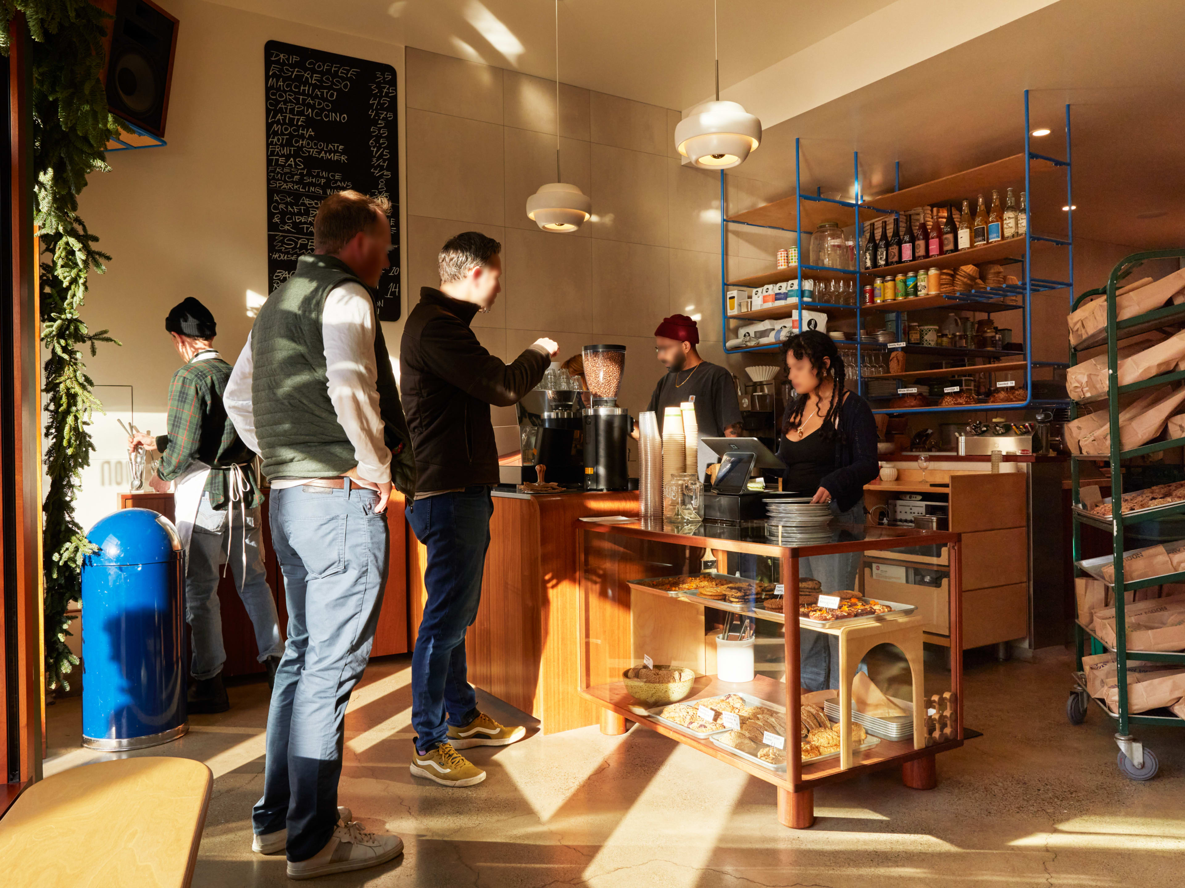 Customers ordering pastries and bread at Day Moon