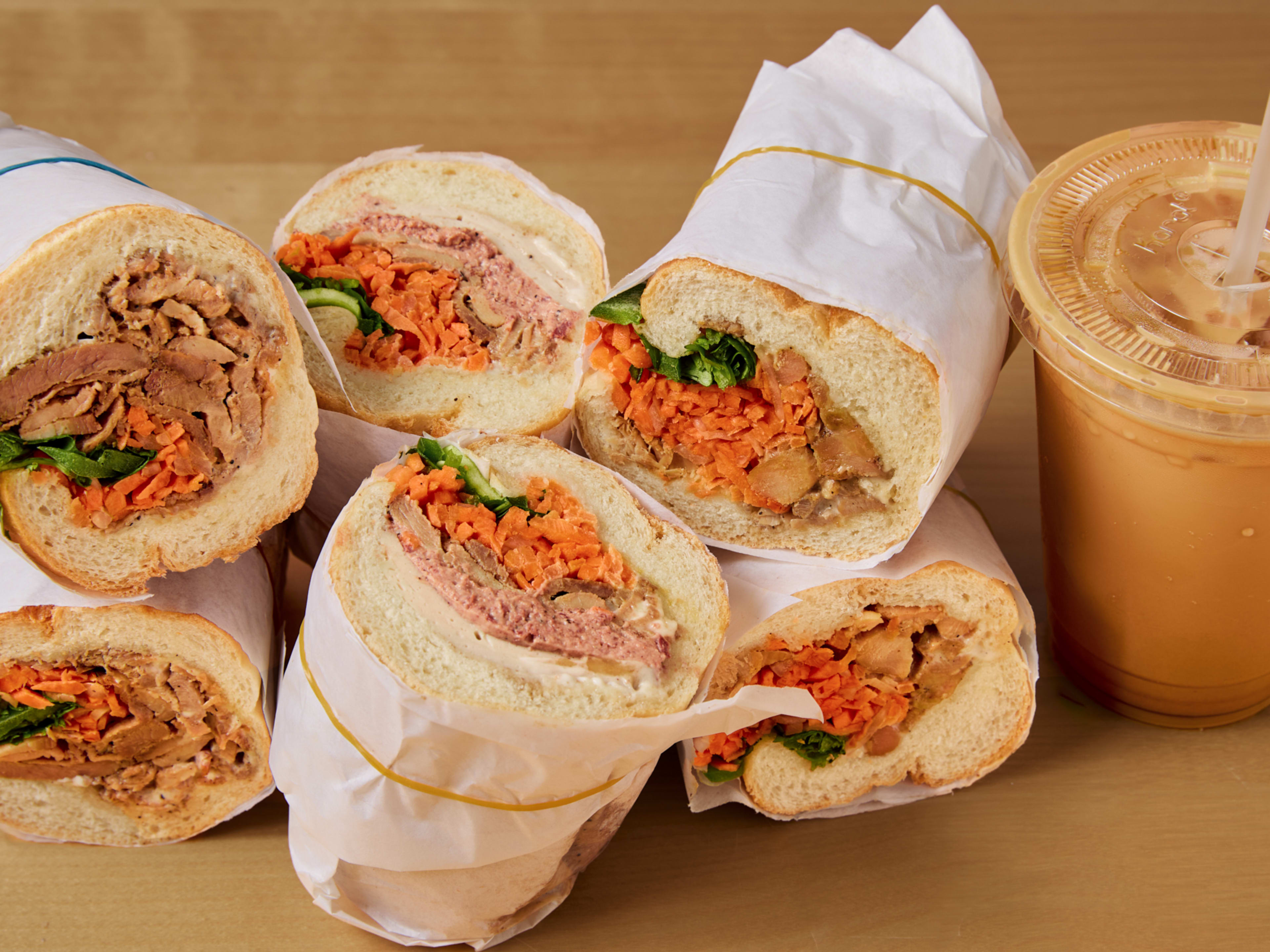 stacked banh mi halves and vietnamese iced coffee