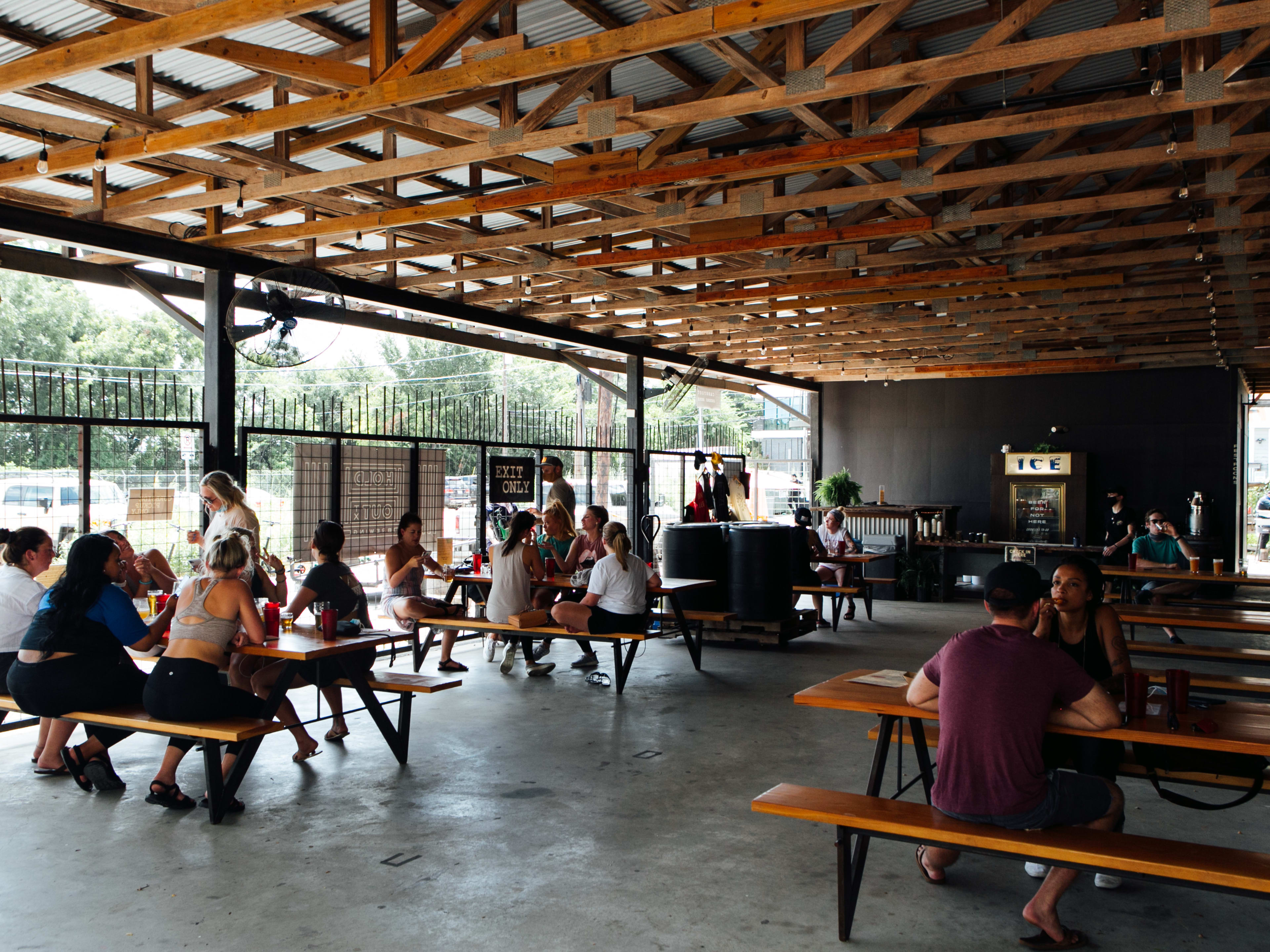 The covered, concrete floor patio at Hold Out Brewing.