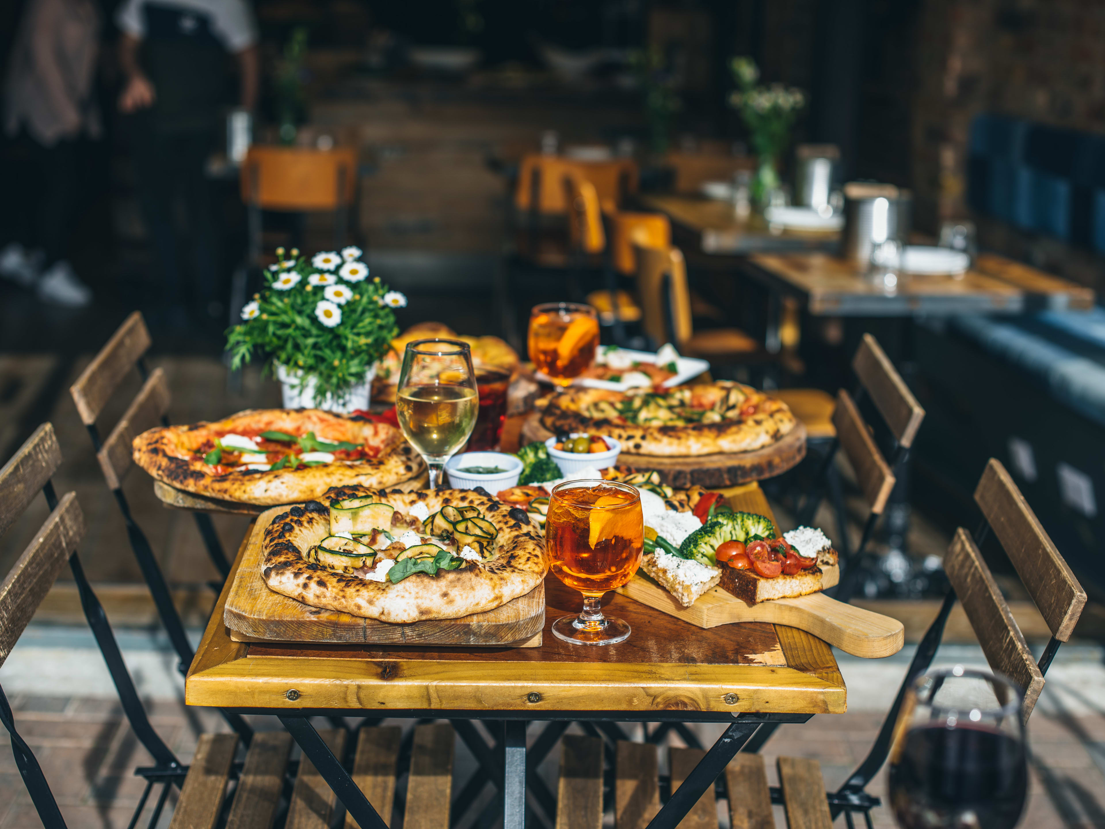 A spread of pizzas and breads at Made In Italy in Chelsea.