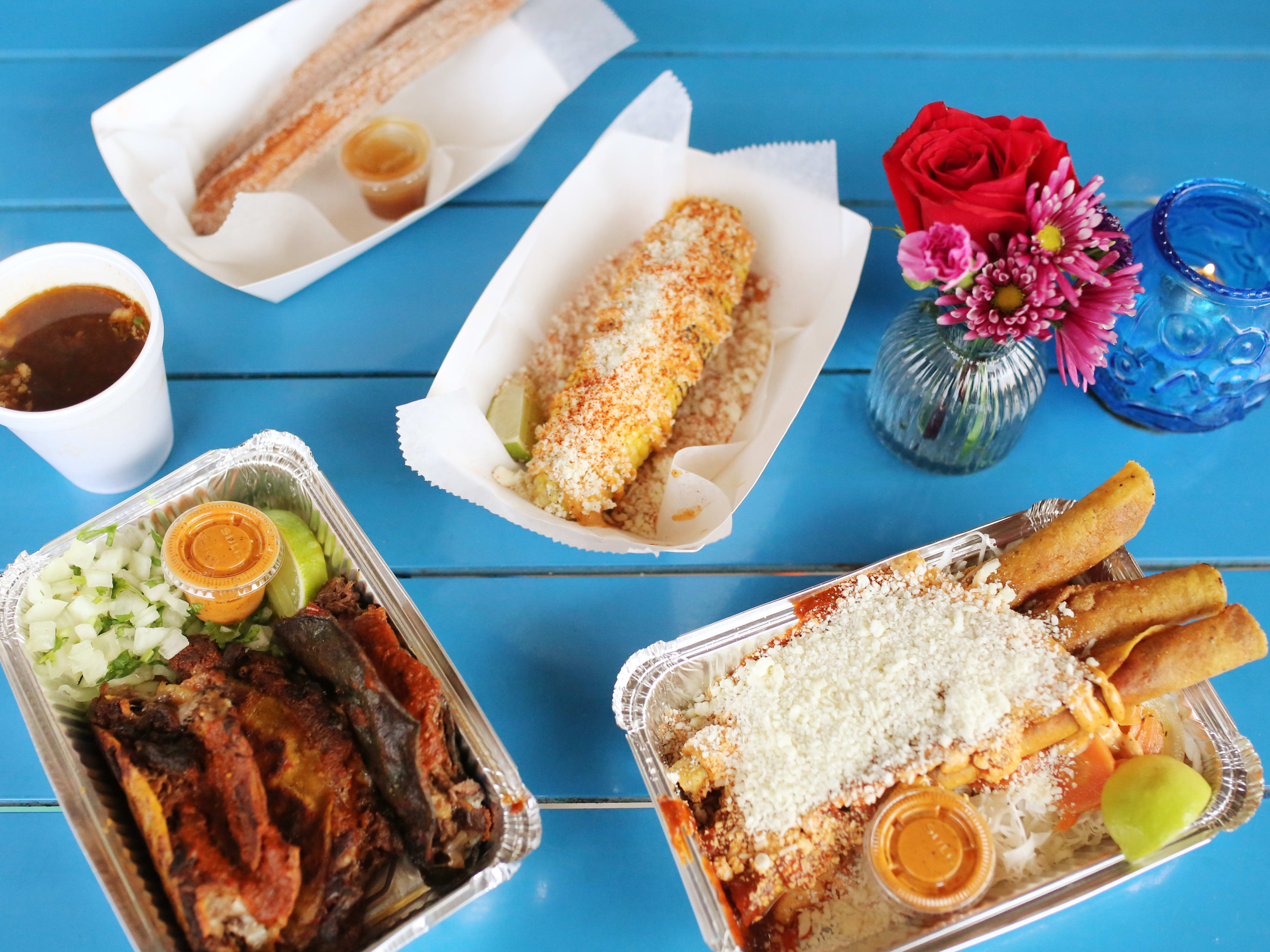 Elote, taquitos, and birria from Maíz De La Vida