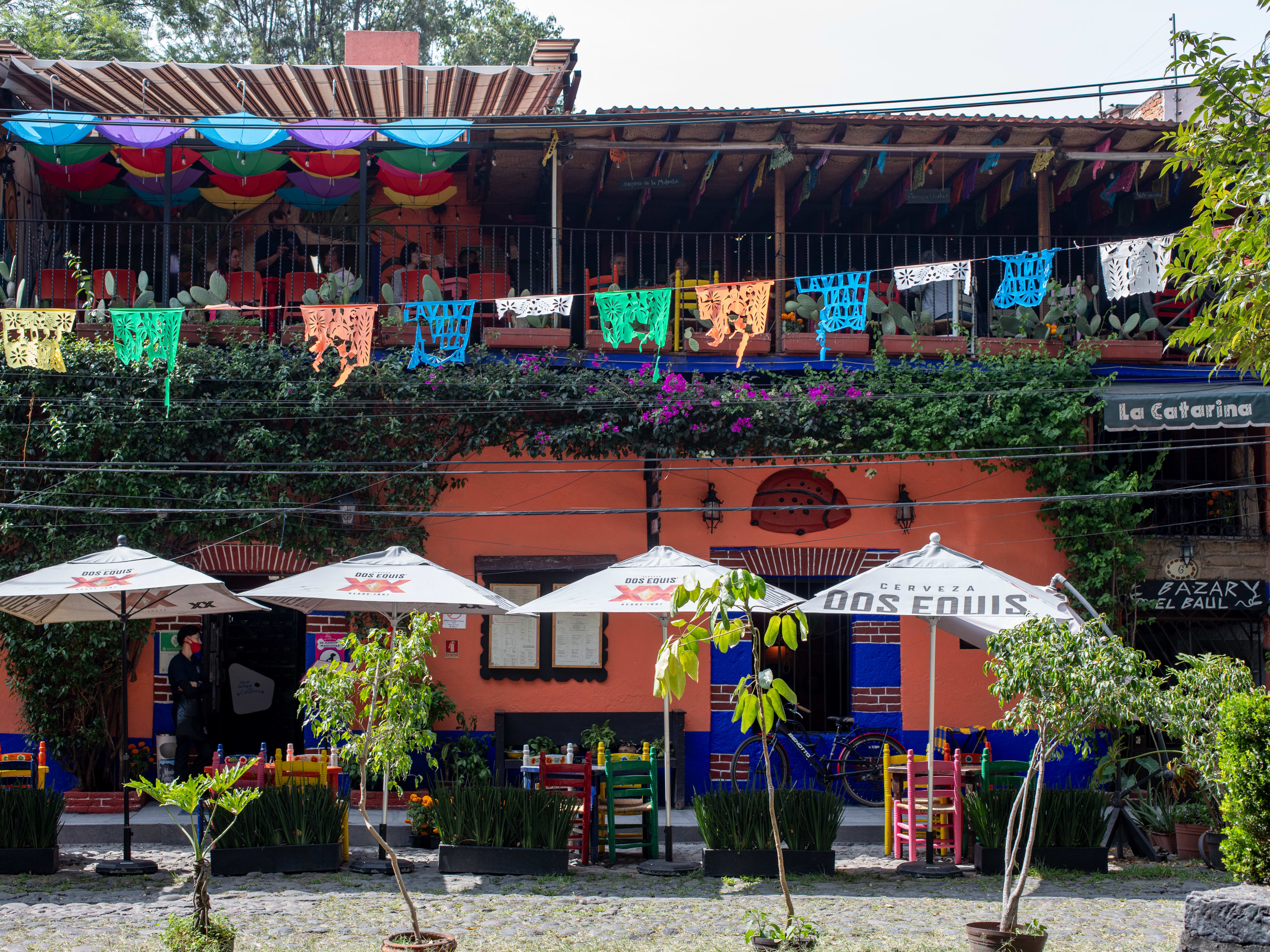 The exterior of a colorful three-story restaurant in Mexico City