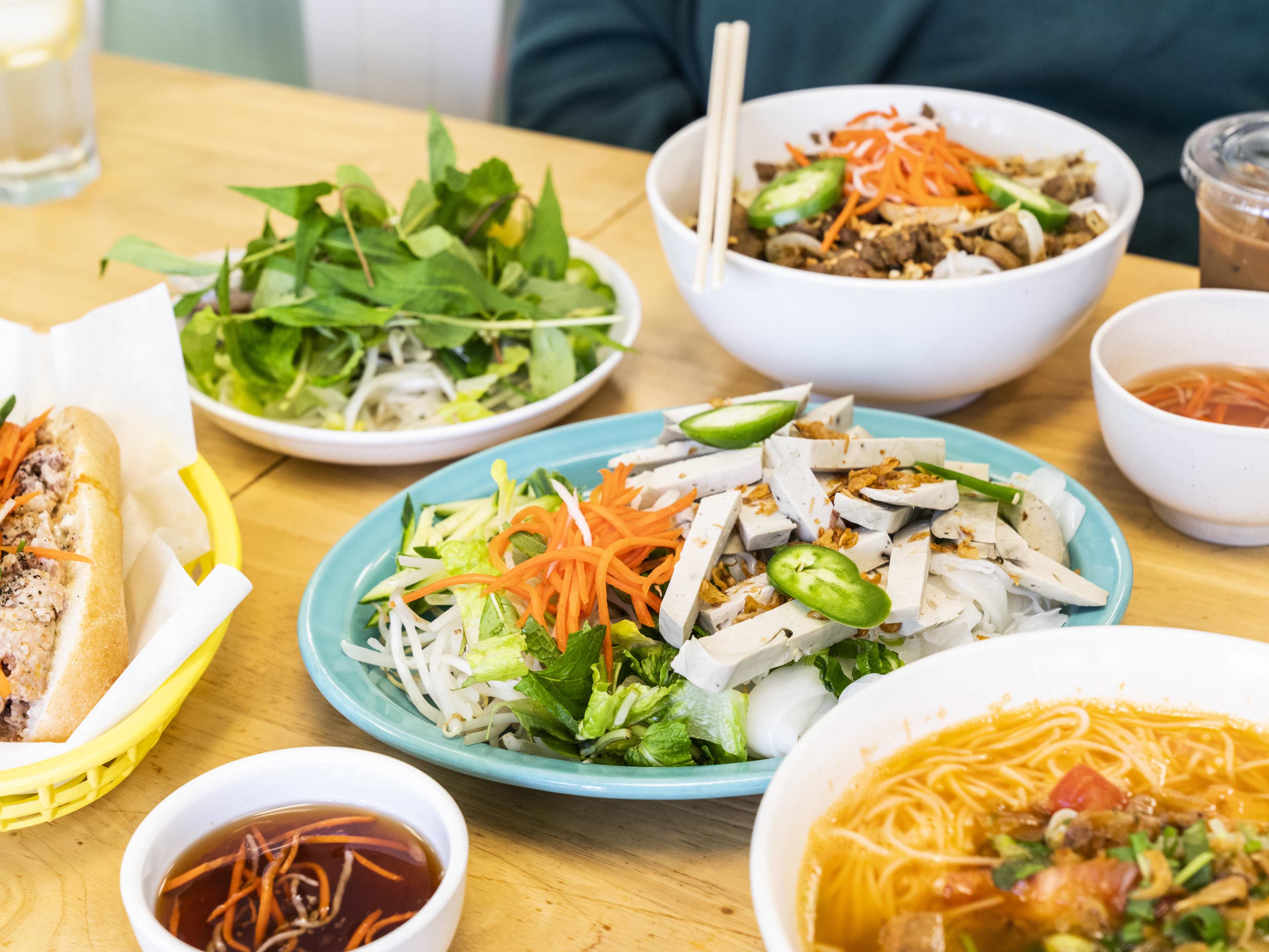 A spread of banh uot chay, bun rieu, bun, and more at Mong Thu