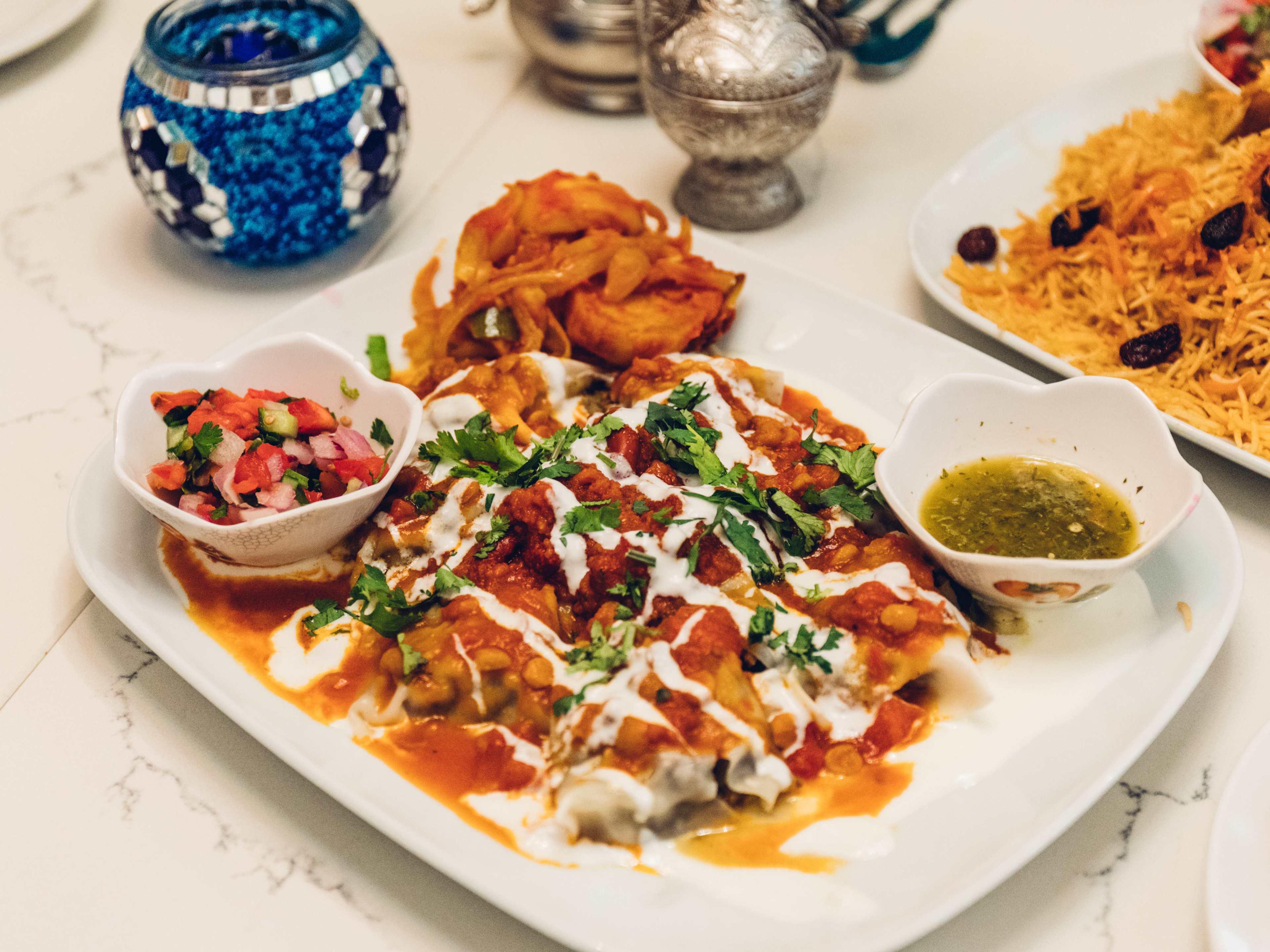 Beef mantu with chutney and green sauce.