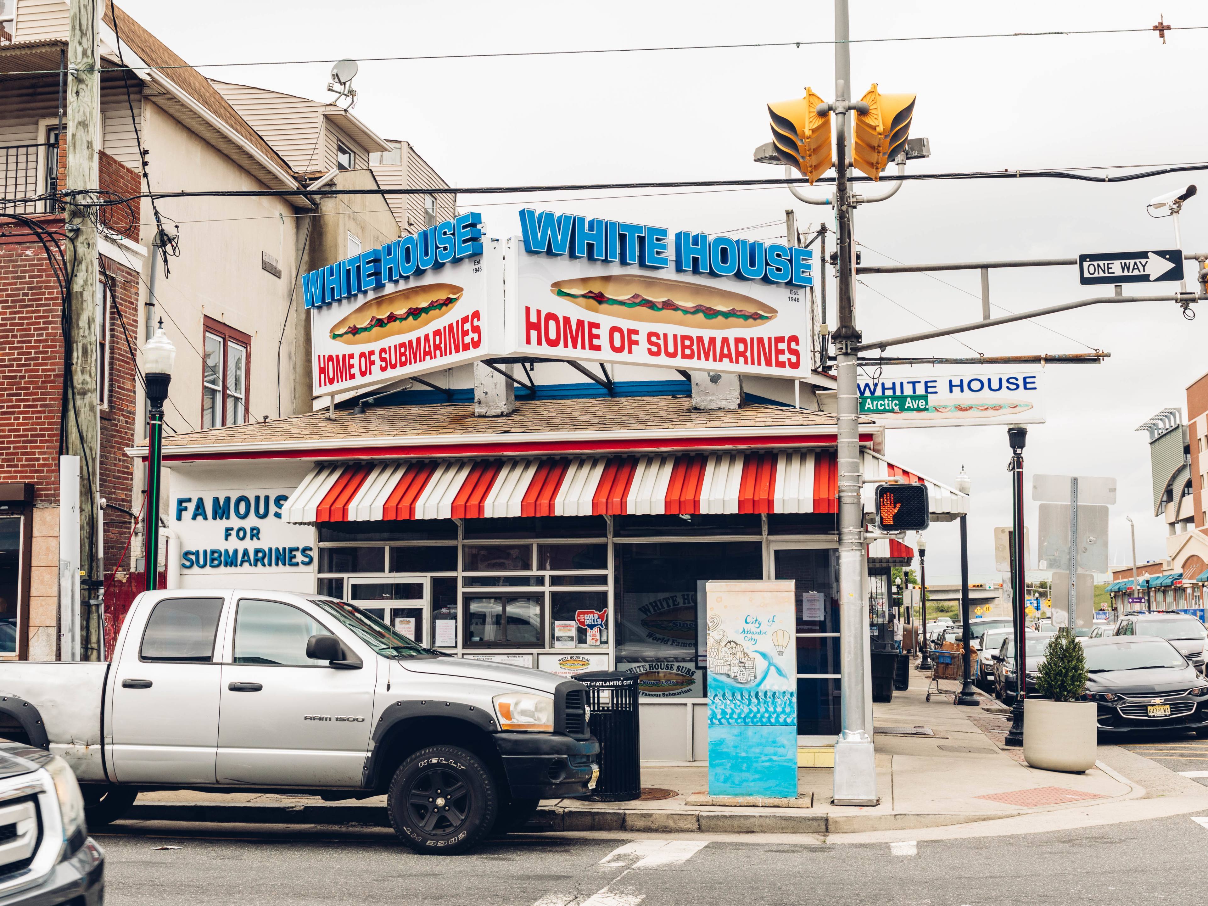 The street view of White House sandwiches with a large marquee sign.