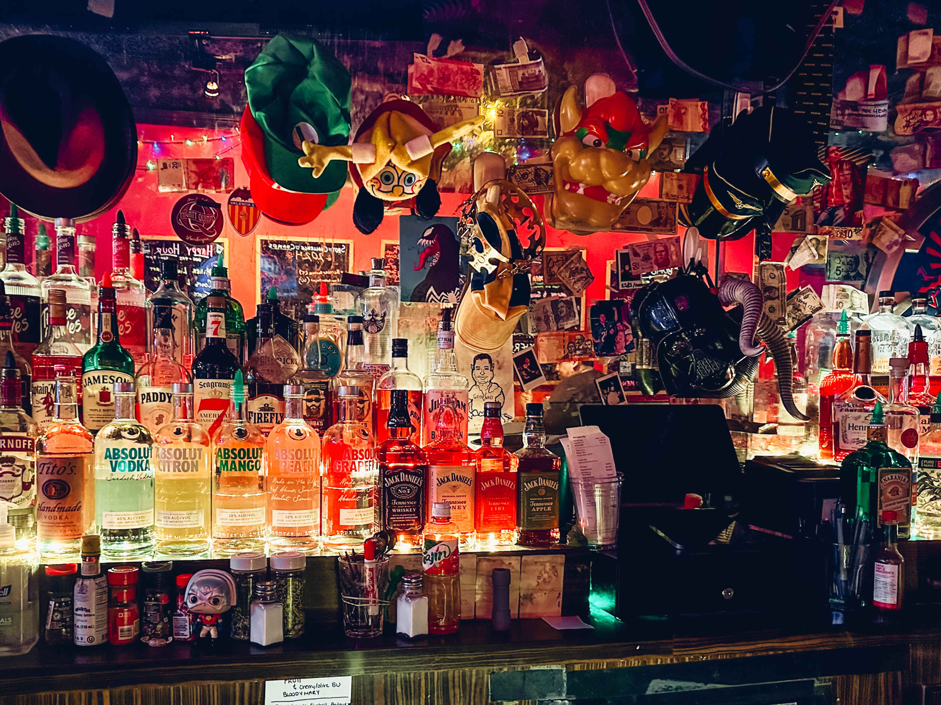 The bar at Barcelona Bar, with hats and other props for themed shots.