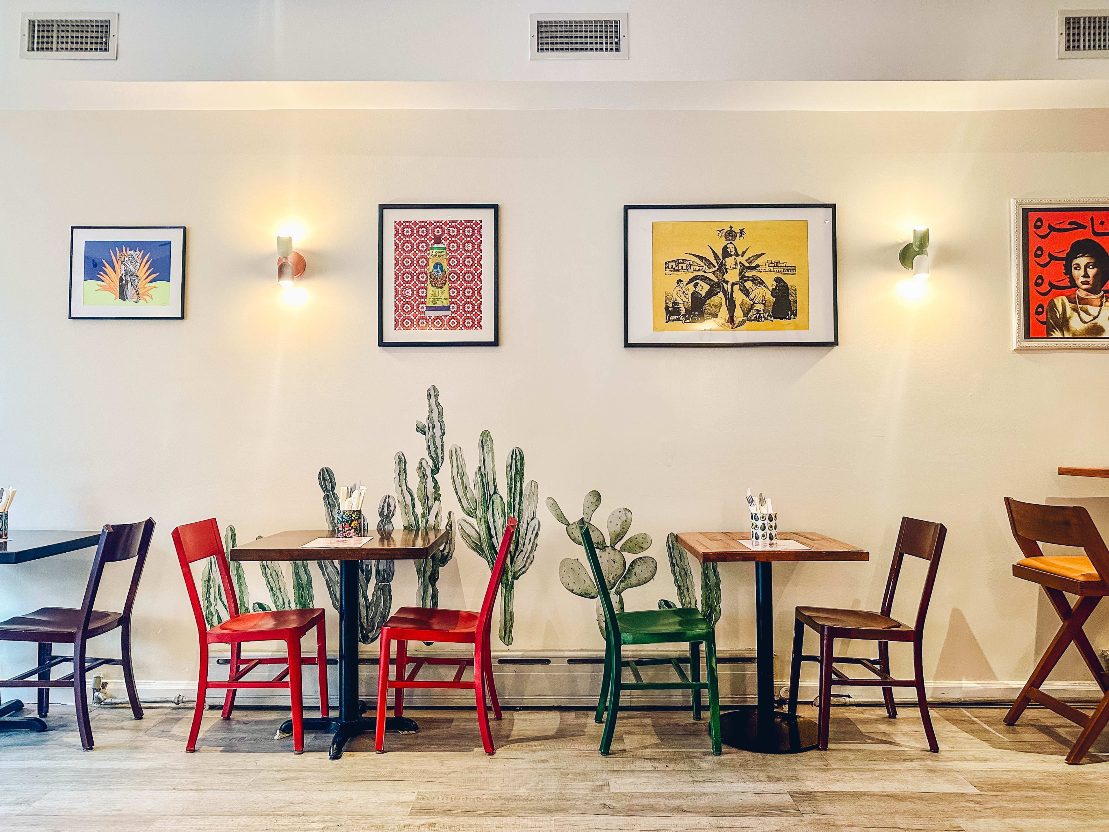 The interior of El Cedro with mismatched chairs.