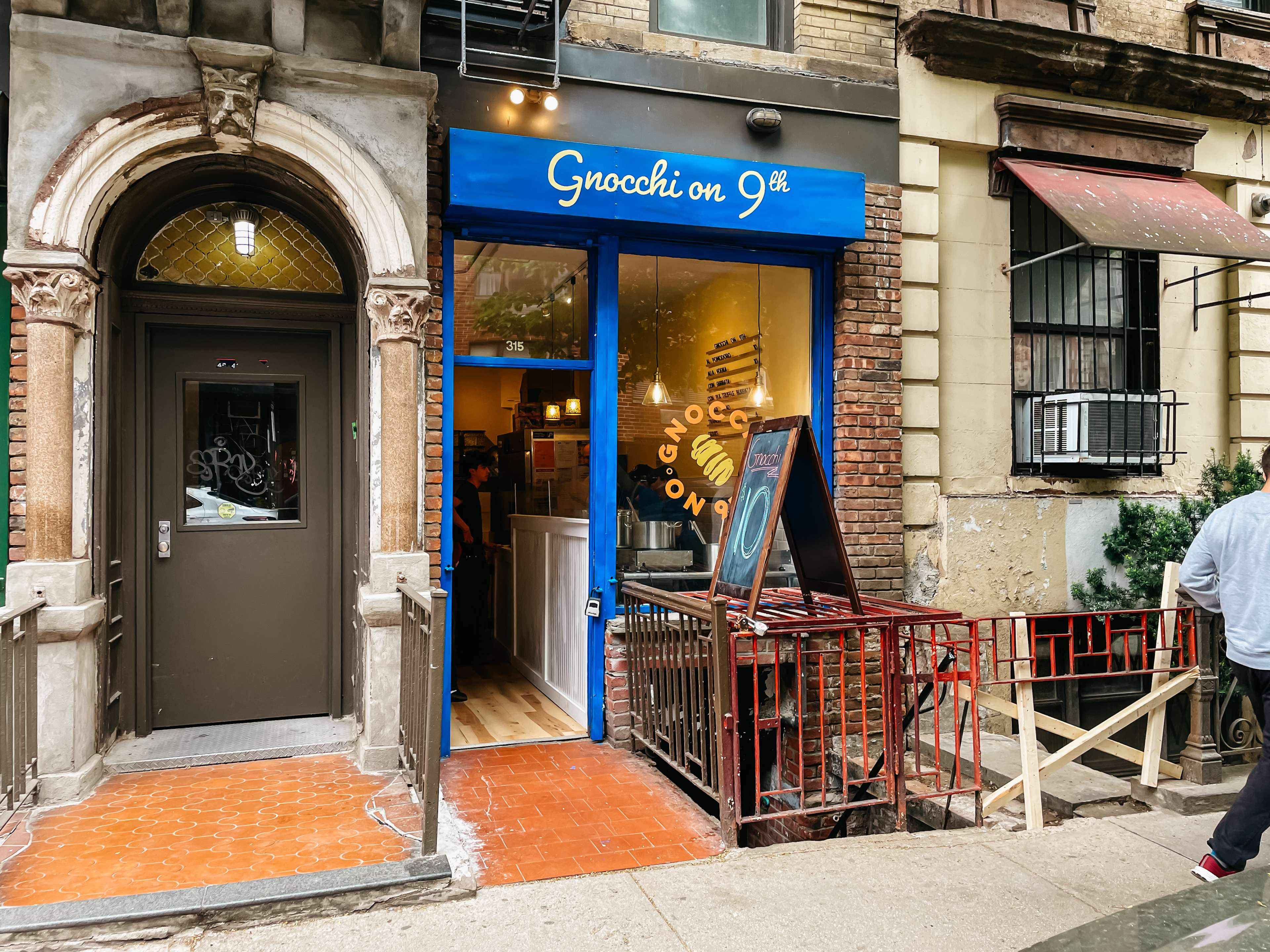 a blue storefront that says gnocchi on 9th