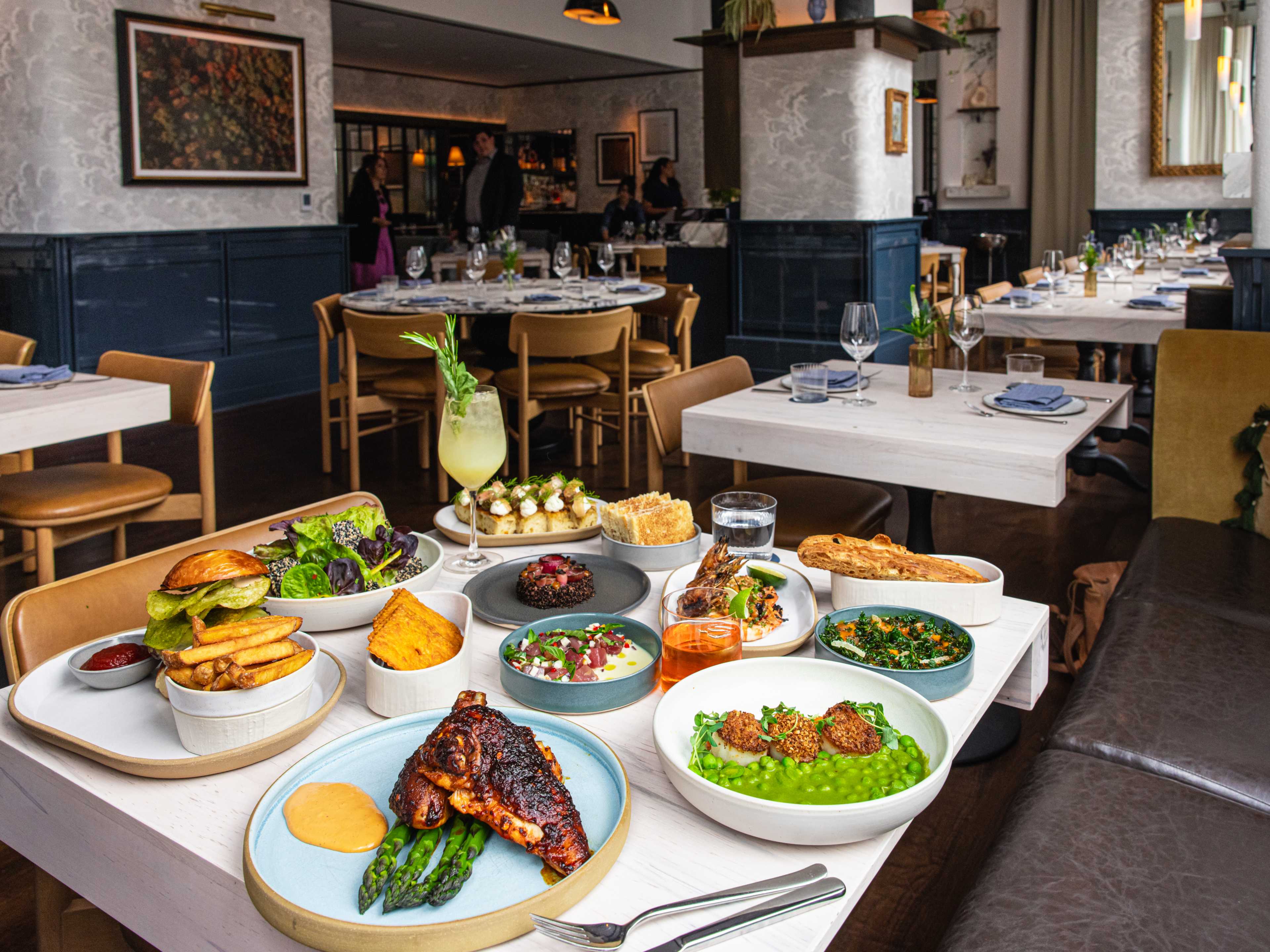 A spread of dishes on a table at Greywind.