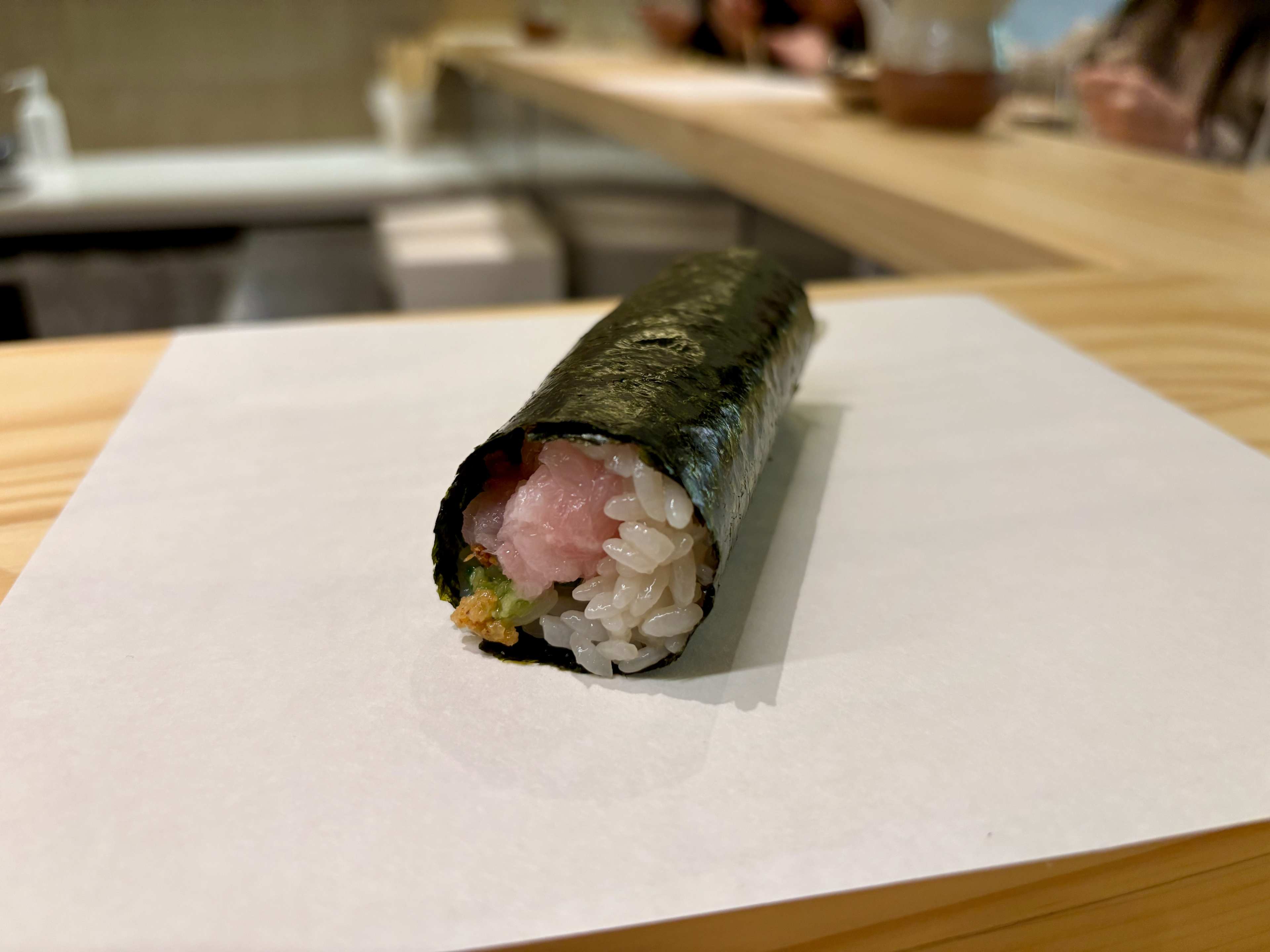 a yellowtail avocado handroll at nori shinn in the east vilalge