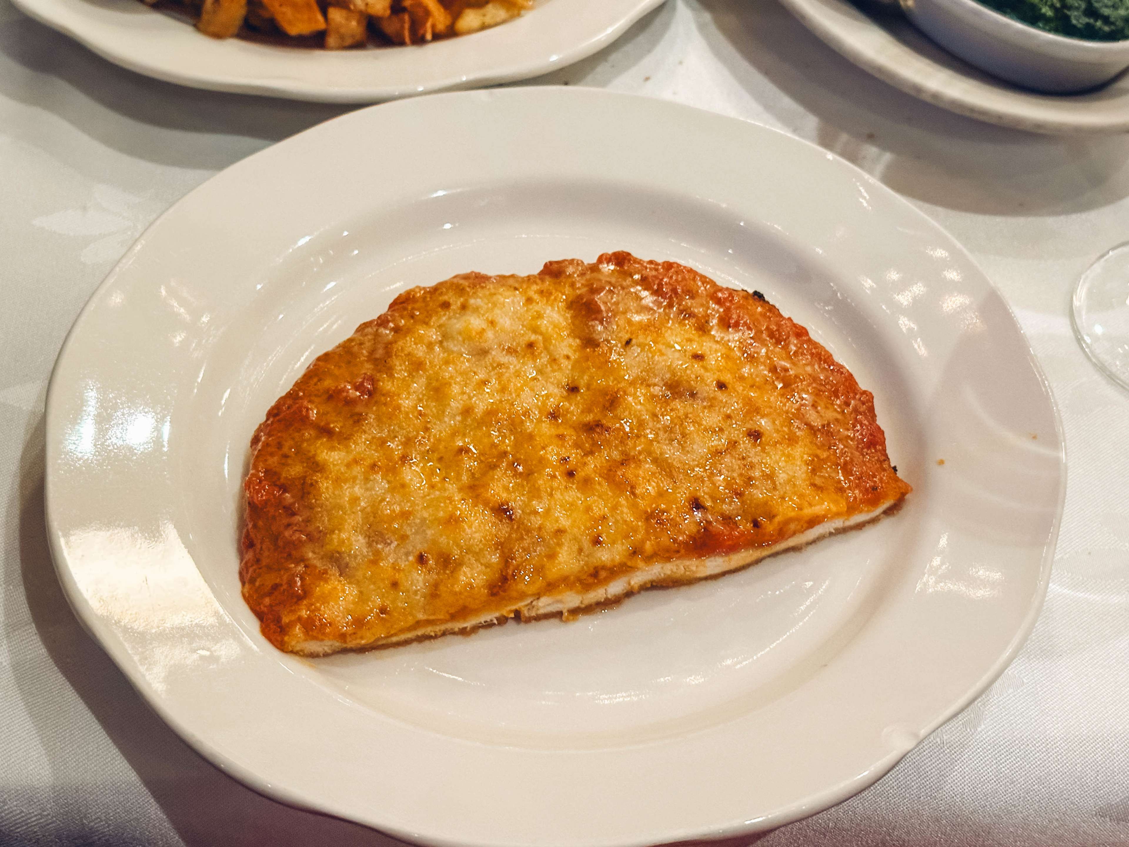Chicken parm on a plate.