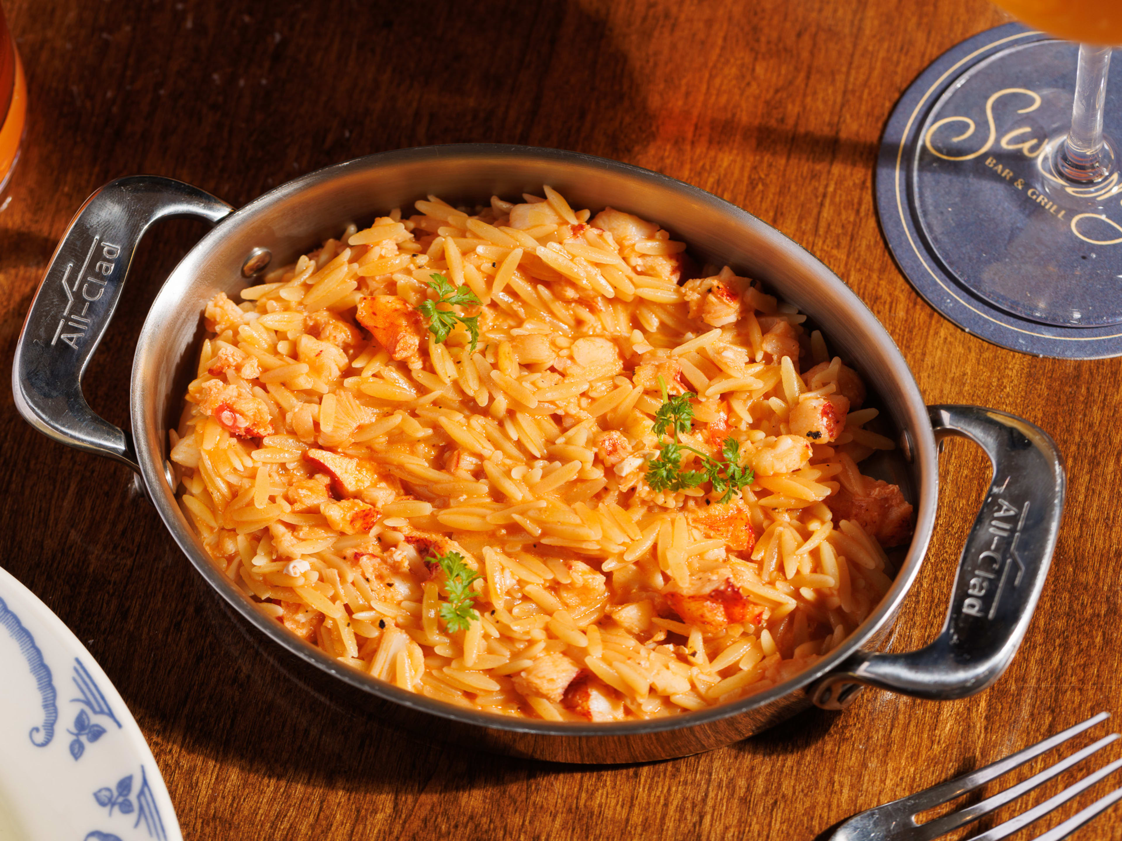 Lobster orzo in a silver pan at Swoony's.